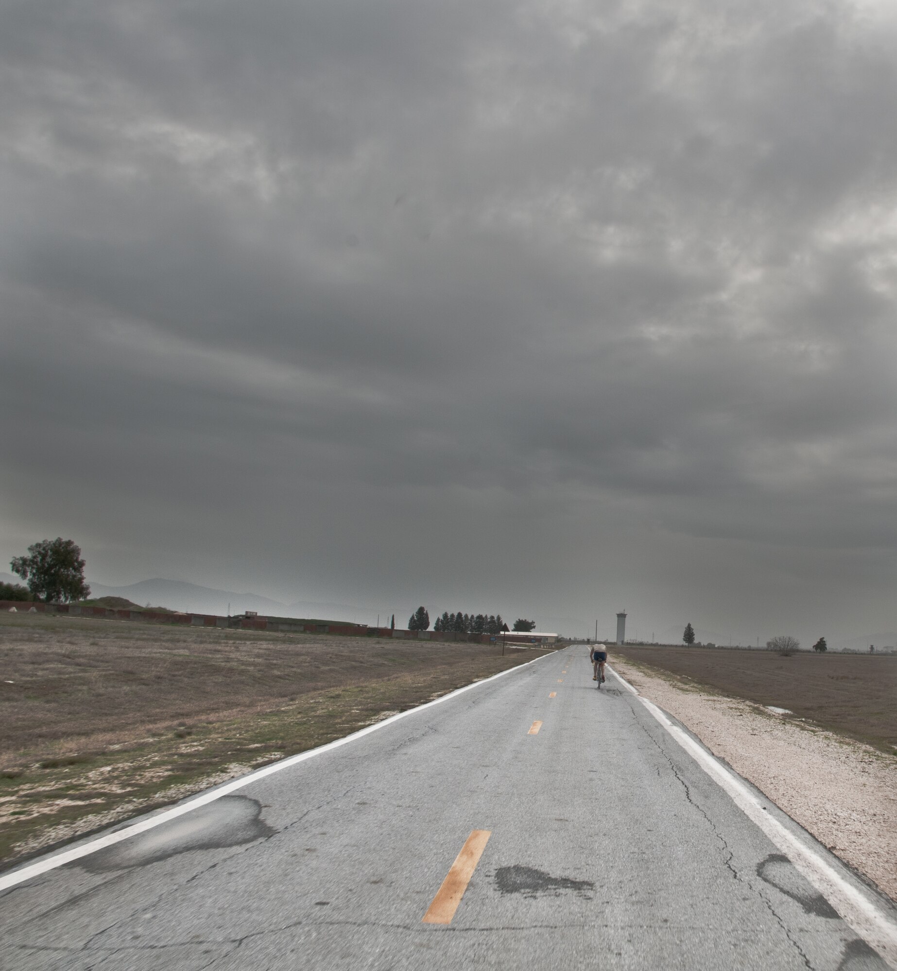 1st Lt. Jonathan Murphy, from the 39th Air Base Wing protocol office, bikes toward the next station during the 2011 Incirlik Winterthon Feb. 26, 2011, at Incirlik Air Base, Turkey. The three-part event included a 10 kilometer run, 20 kilometer bike ride and a 10-shot skeet shoot. The 39th Force Support Squadron organized the event to promote active lifestyles and boost morale for Incirlik personnel.   (U.S. Air Force photo by Staff Sgt. Alexandre Montes)