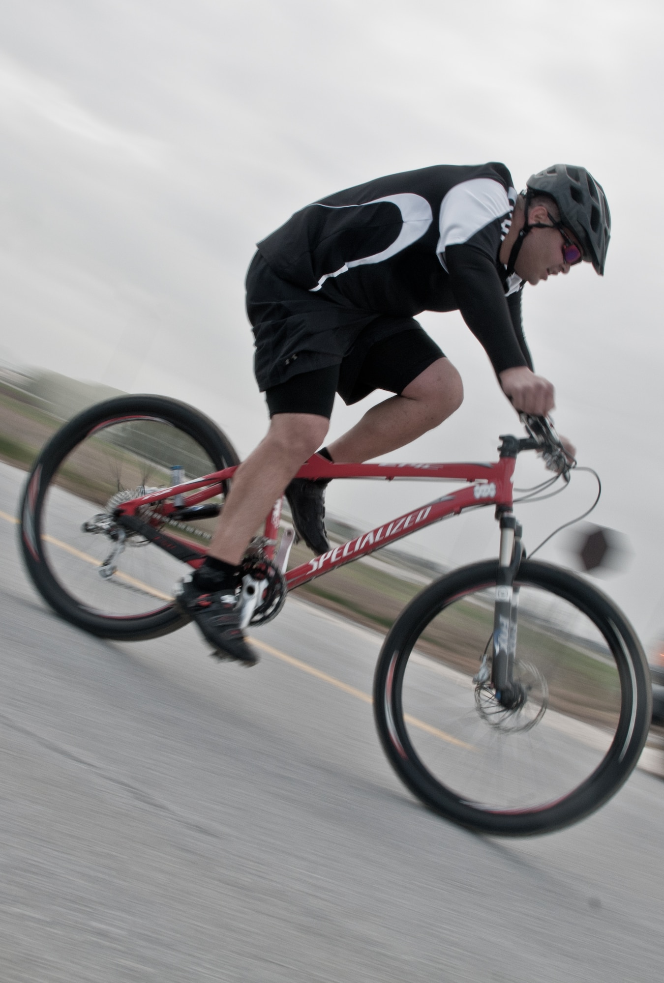 Maj. Mica Ashmore, from the 39th Air Base Wing Equal Opportunity Office, bikes toward the next station during the 2011 Incirlik Winterthon Feb. 26, 2011, at Incirlik Air Base, Turkey. The three-part event included a 10 kilometer run, 20 kilometer bike ride and a 10-shot skeet shoot. The 39th Force Support Squadron organized the event to promote active lifestyles and boost morale for Incirlik personnel.   (U.S. Air Force photo by Staff Sgt. Alexandre Montes)