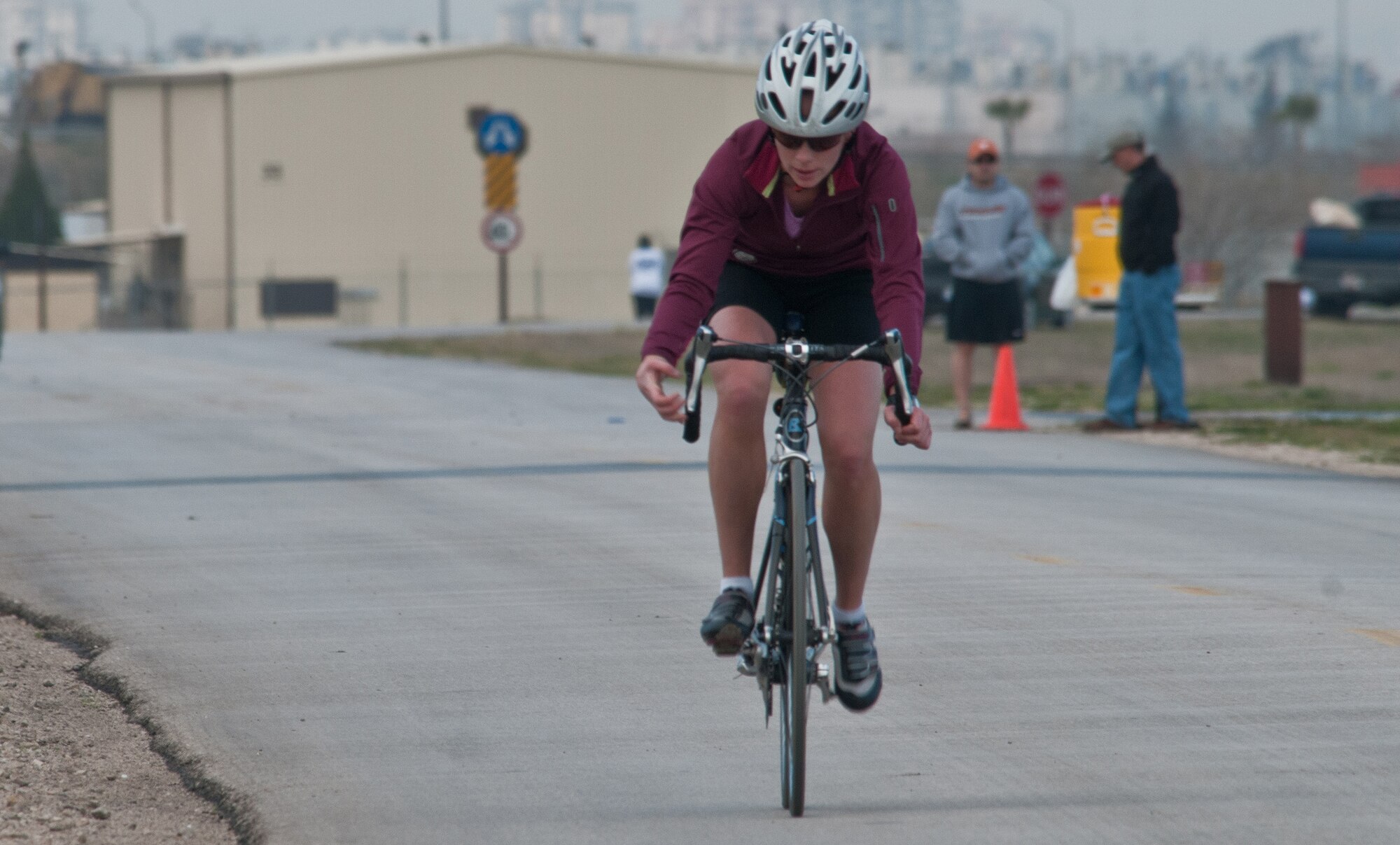 Capt. Elissa Ballas, 39th Medical Operation Squadron, bikes toward the next station during the 2011 Incirlik Winterthon Feb. 26, 2011, at Incirlik Air Base, Turkey. The three-part event included a 10 kilometer run, 20 kilometer bike ride and a 10-shot skeet shoot. The 39th Force Support Squadron organized the event to promote active lifestyles and boost morale for Incirlik personnel.   (U.S. Air Force photo by Staff Sgt. Alexandre Montes)