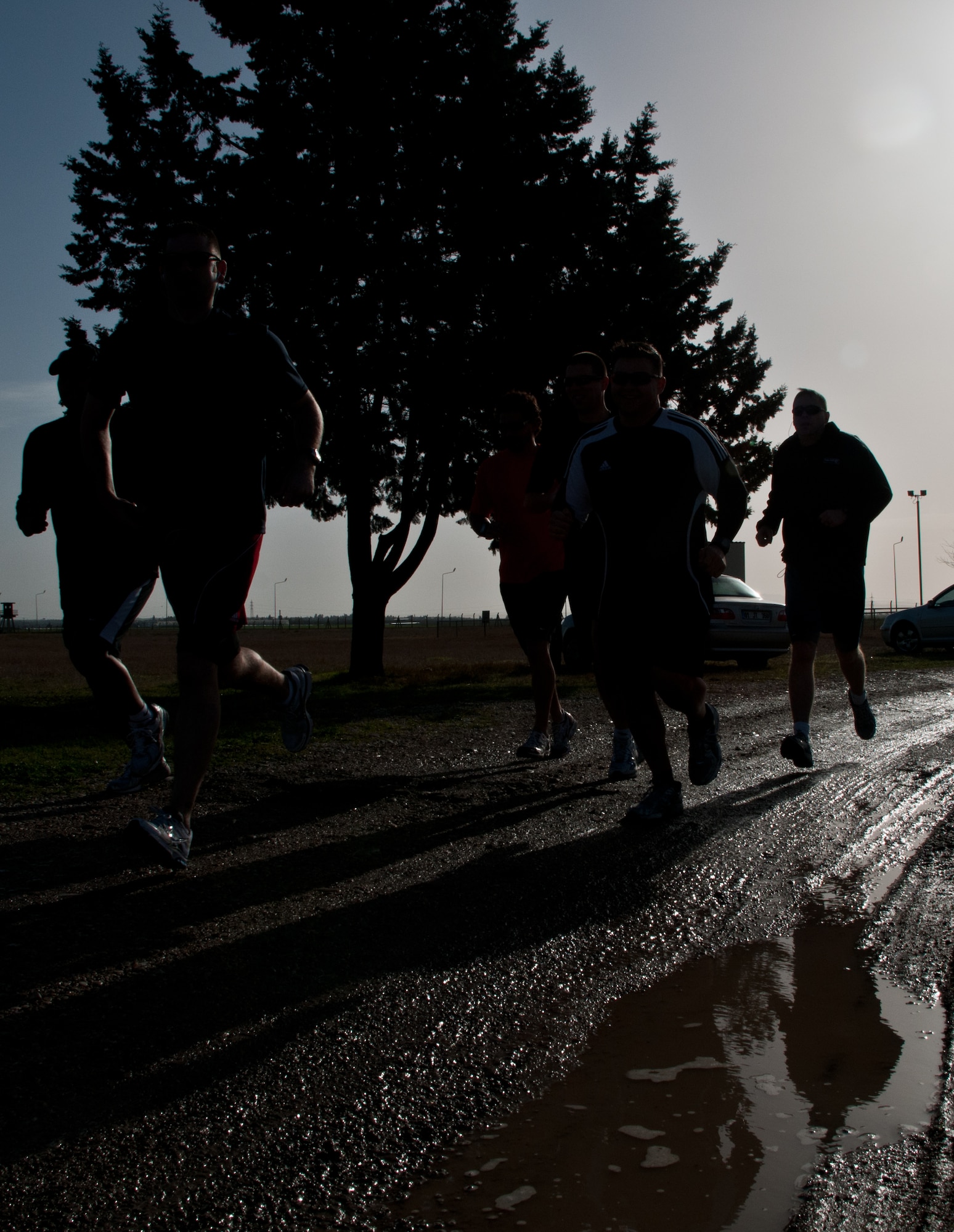 Participating Airmen begin the 10 kilometer run, the first element of the 2011 Incirlik Winterthon,  Feb. 26, 2011, at Incirlik Air Base, Turkey. The three-part event included a 10 kilometer run, 20 kilometer bike ride and a 10-shot skeet shoot. The 39th Force Support Squadron organized the event to promote active lifestyles and boost morale for Incirlik personnel.   (U.S. Air Force photo by Staff Sgt. Alexandre Montes)