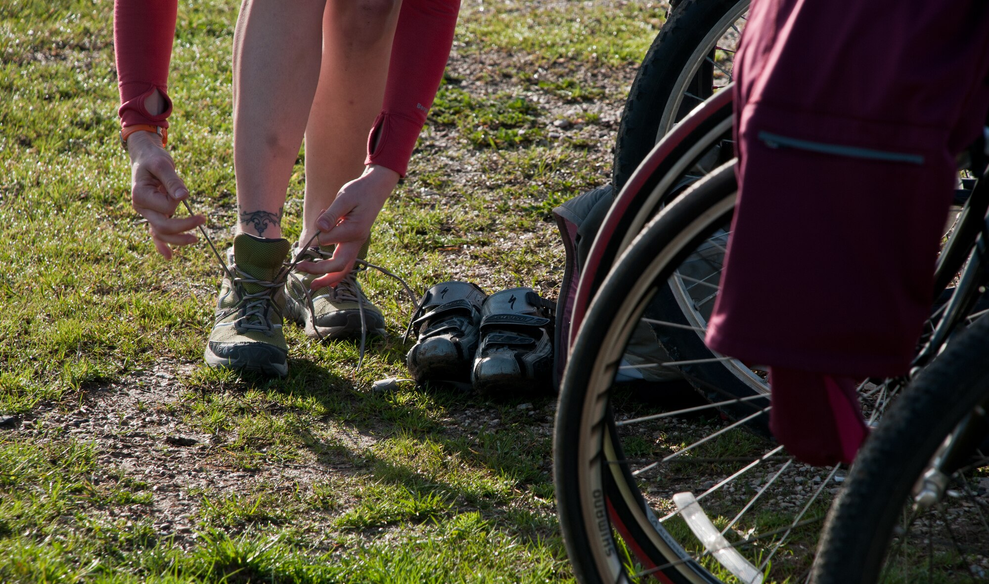 A competitor switches equipment during stages of the 2011 Incirlik Winterthon Feb. 26, 2011, at Incirlik Air Base, Turkey. The three-part event included a 10 kilometer run, 20 kilometer bike ride and a 10-shot skeet shoot. The 39th Force Support Squadron organized the event to promote active lifestyles and boost morale for Incirlik personnel.  (U.S. Air Force photo by Staff Sgt. Alexandre Montes)
