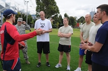 Airmen joined Sailors in gaining some knowledge about Australian Rules Football from players representing the Melboune Demons Football Club at Gosch’s Paddock in Melbourne, Australia, March 4, 2011. The Airmen are from Kadena Air Base, Japan, and Dyess Air Force Base, Texas, while the Sailors are from the  San Diego-based USS Shoup. The two groups took time out from attending the Avalon 2011 Australian International Airshow and Aerospace and Defence Exposition in Geelong, Australia. The event is one of the largest airshows in the world. The U.S. and Australian alliance spans more than 60 years and provides an opportunity for U.S and senior military officials to engage with their Australian counterparts, and ultimately contribute toward interoperability between the forces. (U.S.  Air Force photo/Master Sgt. Cohen A. Young)