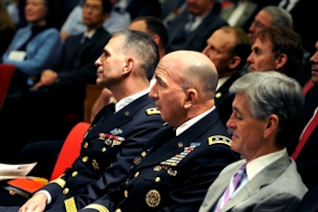 Army Lt. Gen. Michael L. Oates, left, outgoing director of the Joint Improvised Explosive Device Defeat Organization, listens with his successor, Army Lt. Gen. Michael D. Barbero, as Deputy Defense Secretary William J. Lynn III presides over the change of directorship ceremony in the Pentagon, March 4, 2011. They were joined by Army Secretary John McHugh, right.