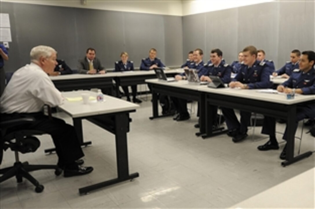 Defense Secretary Robert M. Gates talks with Air Force Academy cadets while teaching a national security class as part of the Capstone Seminar at the Air Force Academy in Colorado Springs, Colo., March 4, 2011. Later, Gates addressed all the cadets in a speech that marked his last visit to the academy. 