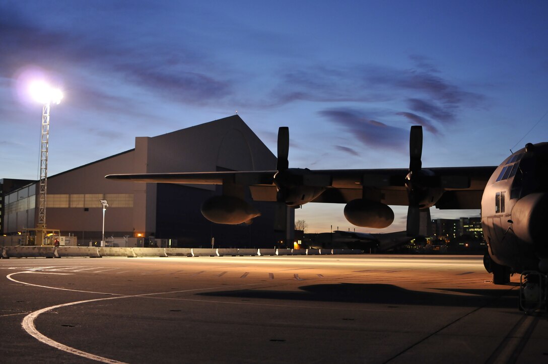 A California Air National Guard MC-130P Combat Shadow aircraft is parked on the flightline during sunrise as members of the 129th Rescue Wing arrive for monthly drill at Moffett Federal Airfield, Calif., Feb. 6, 2011. (Air National Guard photo by Staff Sgt. Kim E. Ramirez/Released) 