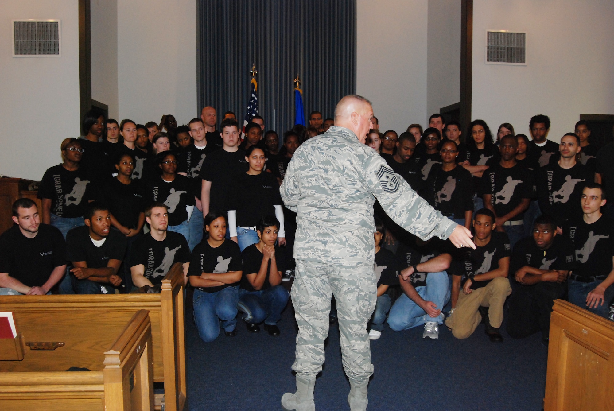 Command Chief Master Sgt. John M. Anderson of the 94th Airlift Wing spoke with the Delayed Entry Program participants at the Dobbins Chapel during the March 5 Unit Training Assembly.  The Air Force Delayed Entry Program is an Air Force initiative where a future Airman may enlist in a Reserve unit of the United States Air Force and specify a future reporting date to attend basic training.  Chief Anderson spent countless hours motivating and sharing with the Airmen of this program over the years; he is scheduled  to retire in April. (U.S. Air Force photo/Senior Airman Danielle Campbell)