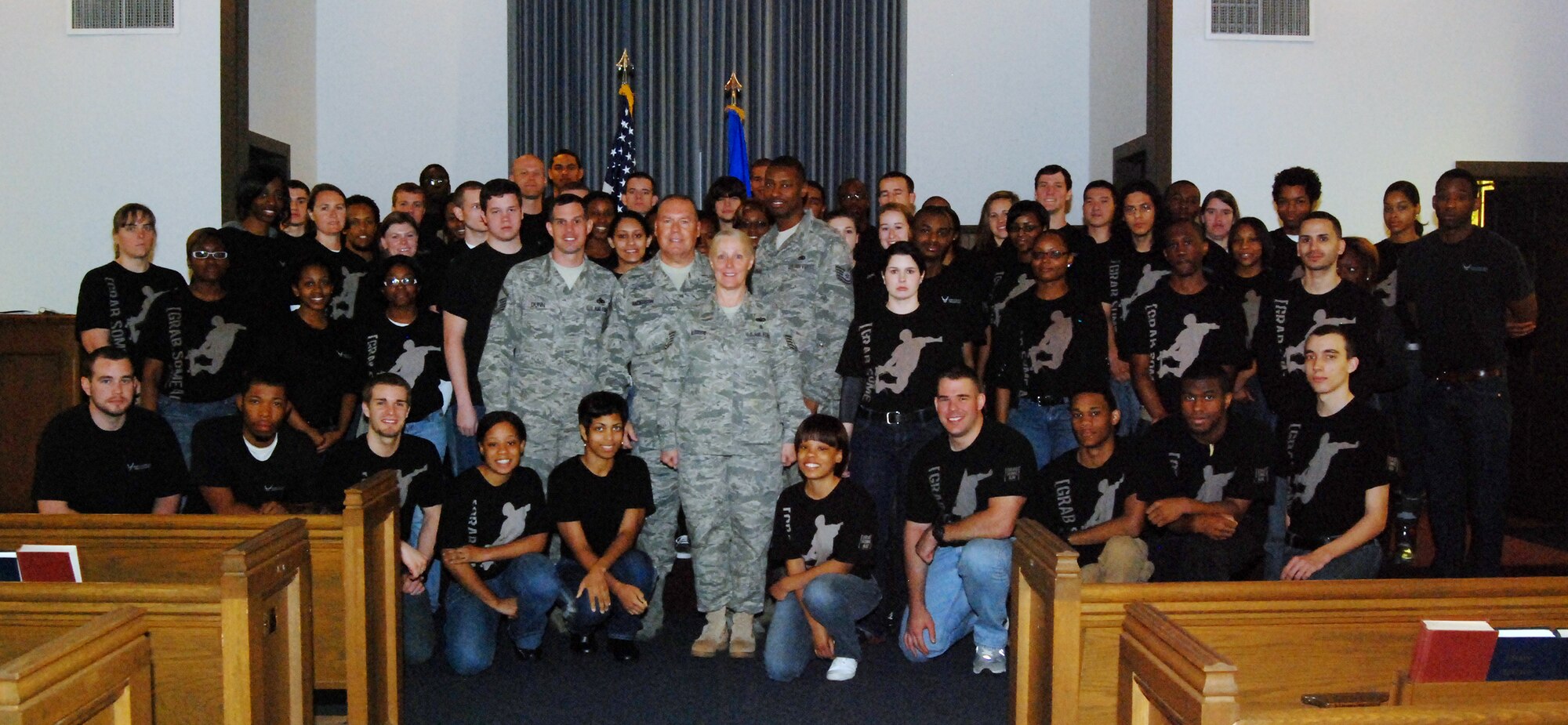 Command Chief Master Sgt. John M. Anderson of the 94th Airlift Wing and the 94th AW recruiters pose with Delayed Entry Program members during the March 5 Unit Training Assembly.  The Air Force Delayed Entry Program is an Air Force initiative where a future Airman may enlist in a Reserve unit of the United States Air Force and specify a future reporting date to attend basic training.  Chief Anderson spent countless hours motivating and sharing with the Airmen of this program over the years; he is scheduled  to retire in April. (U.S. Air Force photo/Senior Airman Danielle Campbell)