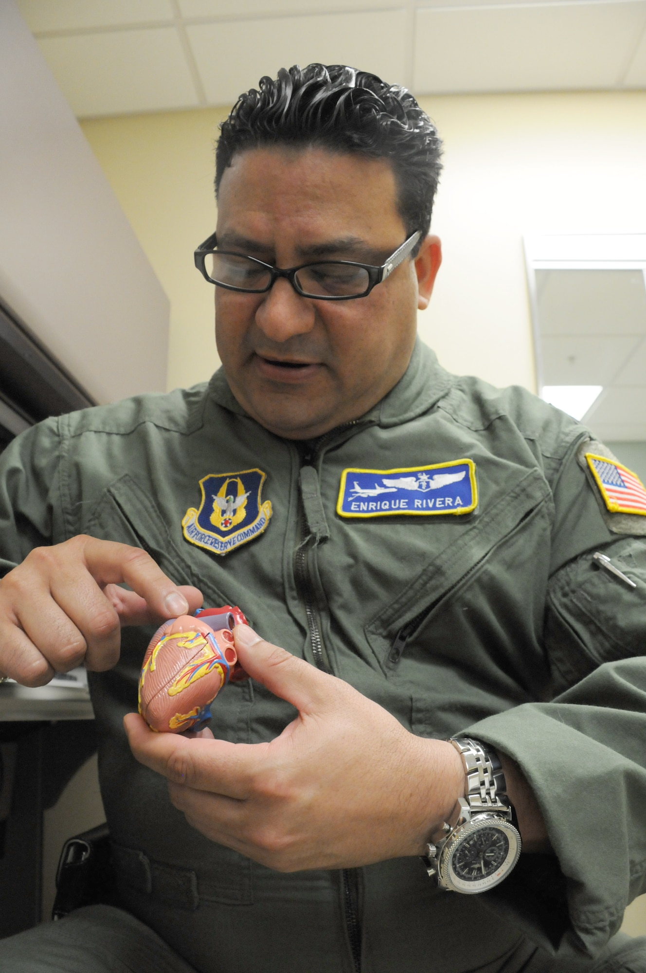 MacDill Air Force Base, Fla. -- Serving others is second nature for Lt. Col. Enrique Rivera.  When not a flight surgeon with the 927th Aeromedical Squadron, the San Juan, Puerto Rico native is busy saving lives as an interventional cardiologist.  Working with the human heart is second nature to a man who gives up his free time to help make sure servicemembers are taken care of.  (Official U.S. Air Force photo by Staff Sgt. Shawn Rhodes)