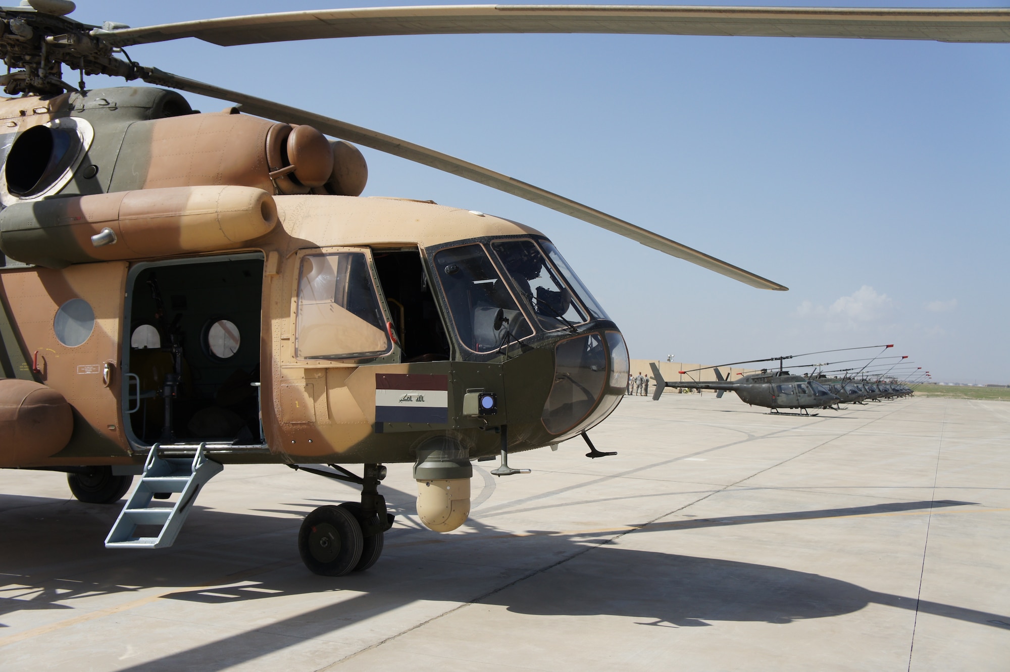 KIRKUK REGIONAL AIR BASE, Iraq – A fleet of Iraqi helicopters await their final takeoff here March 1. The entire fleet was transferred to Habbaniyah following the end of the flight-training contract between the Iraqi Army Aviation Command and the United States Army Security Assistance Training Management Organization. (Courtesy photo)