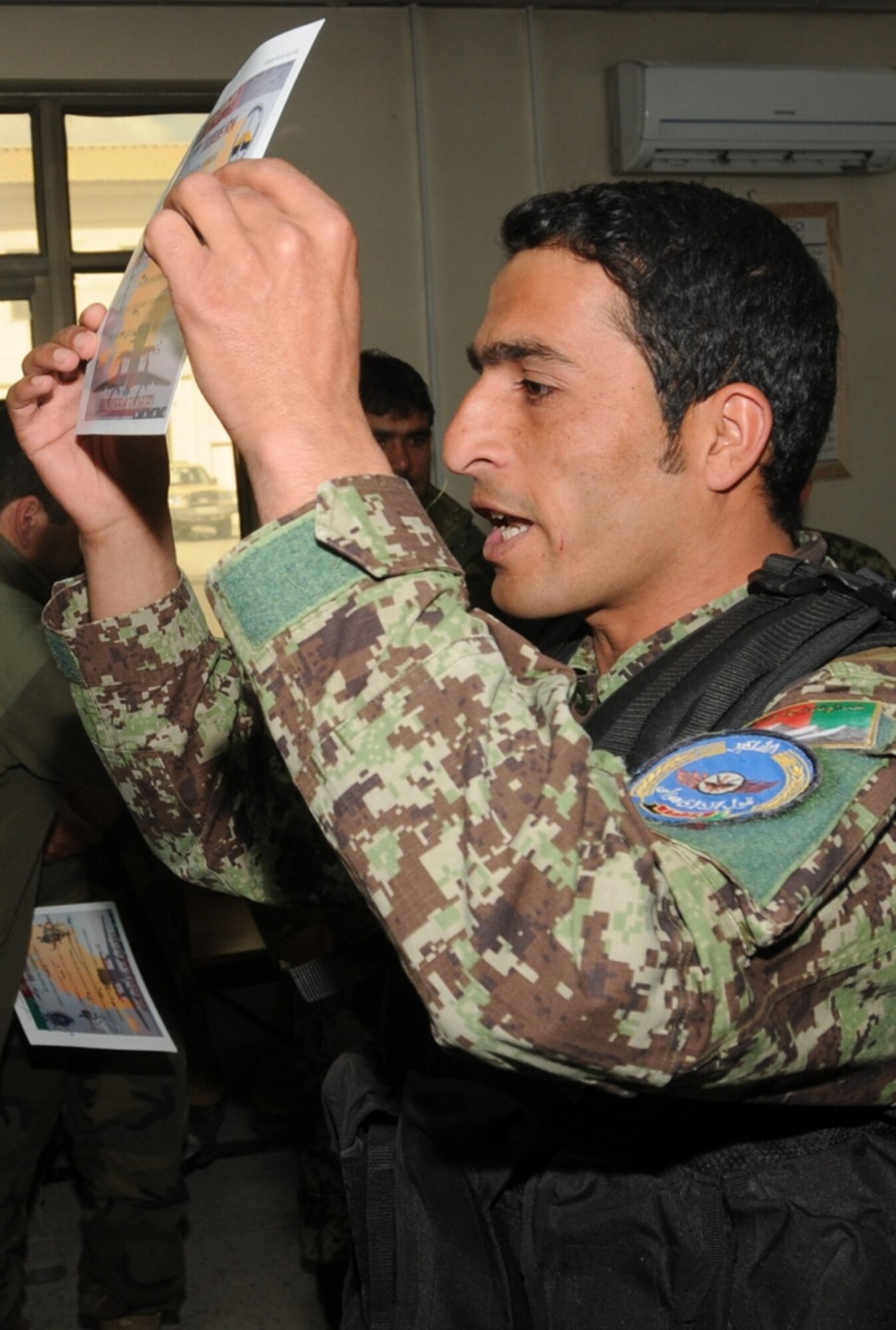 KABUL, Afghanistan - Twenty-five members of the Afghan Air Force, consisting of Airmen through Captain, graduated from the initial quick reaction force training course at the Afghan Air Force base at Kabul, Afghanistan, March 5. (U.S. Navy photo by Mass Communications Specialist 3rd Class Jared E. Walker)