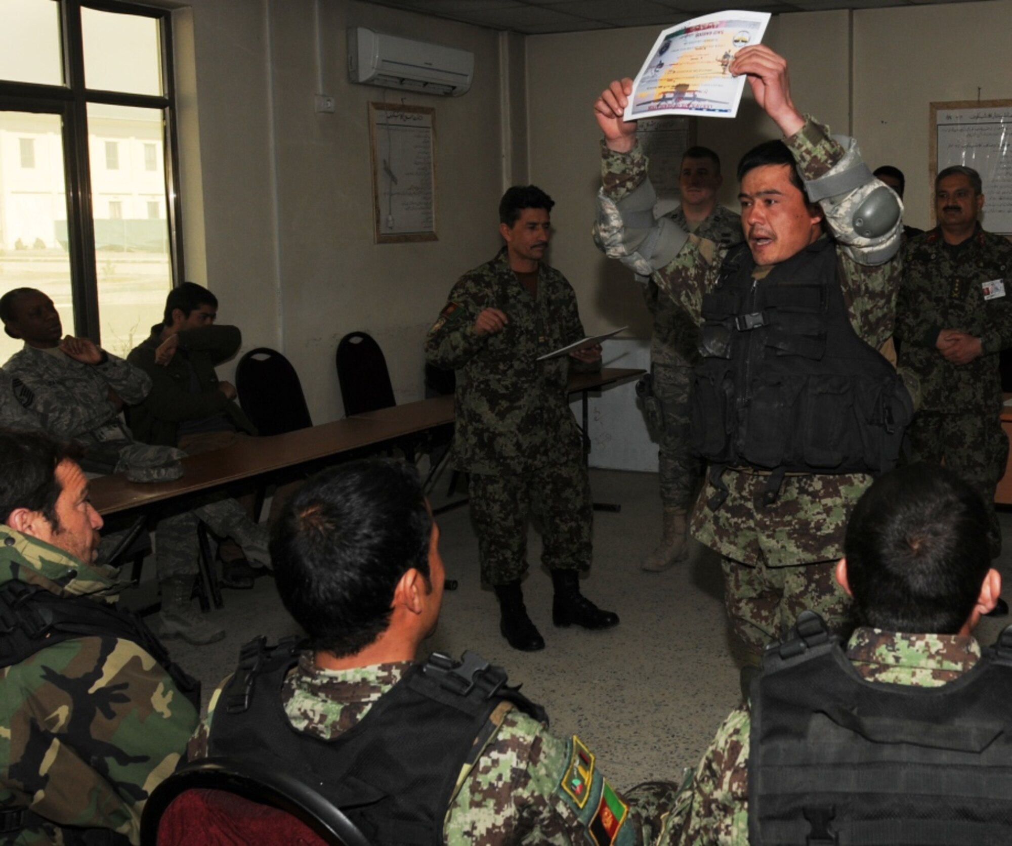 KABUL, Afghanistan - Twenty-five members of the Afghan Air Force, consisting of Airmen through Captain, graduated from the initial quick reaction force training course at the Afghan Air Force base at Kabul, Afghanistan, March 5. (U.S. Navy photo by Mass Communications Specialist 3rd Class Jared E. Walker)