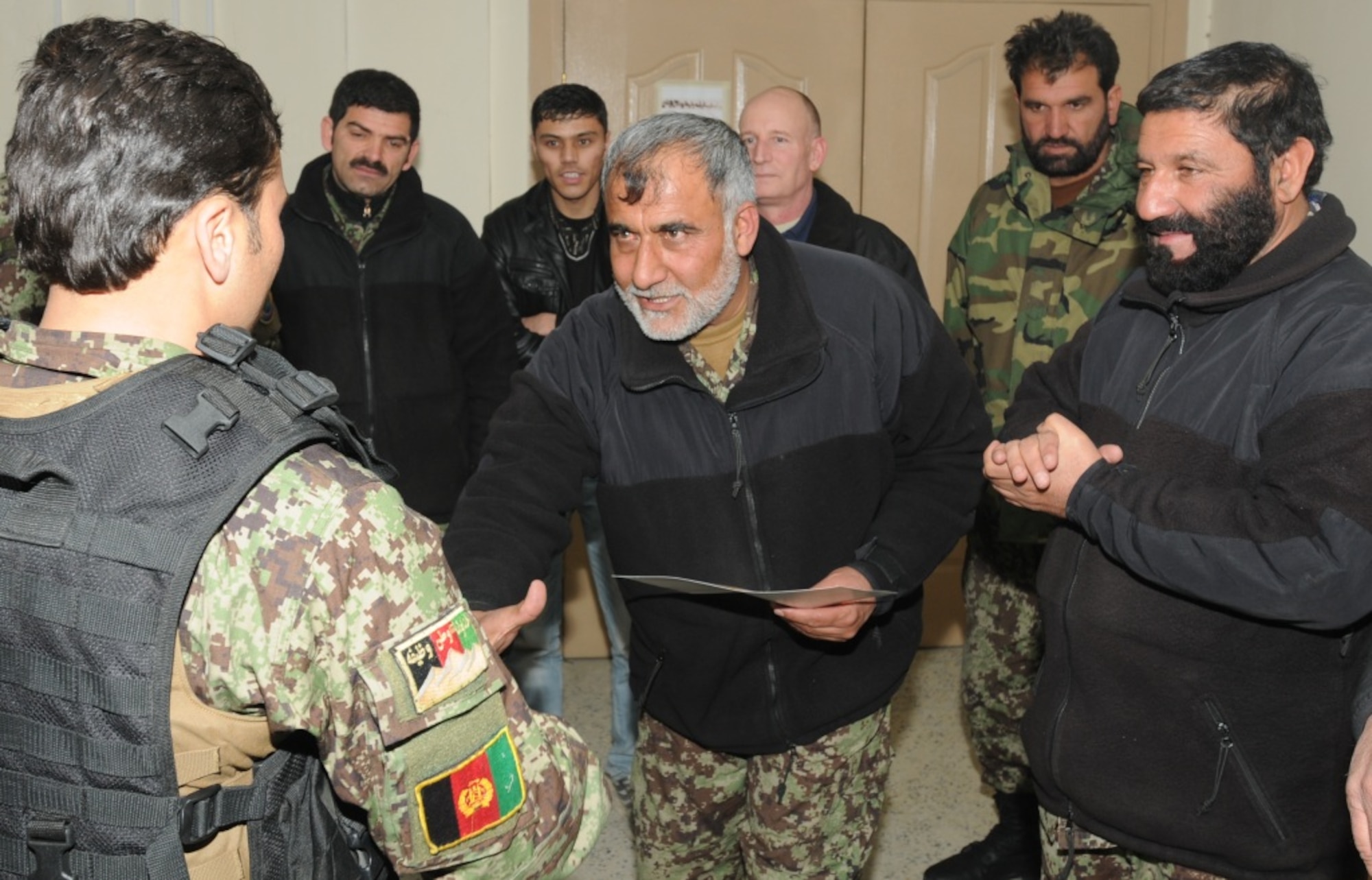 KABUL, Afghanistan - Twenty-five members of the Afghan Air Force, consisting of Airmen through Captain, graduated from the initial quick reaction force training course at the Afghan Air Force base at Kabul, Afghanistan, March 5. (U.S. Navy photo by Mass Communications Specialist 3rd Class Jared E. Walker)