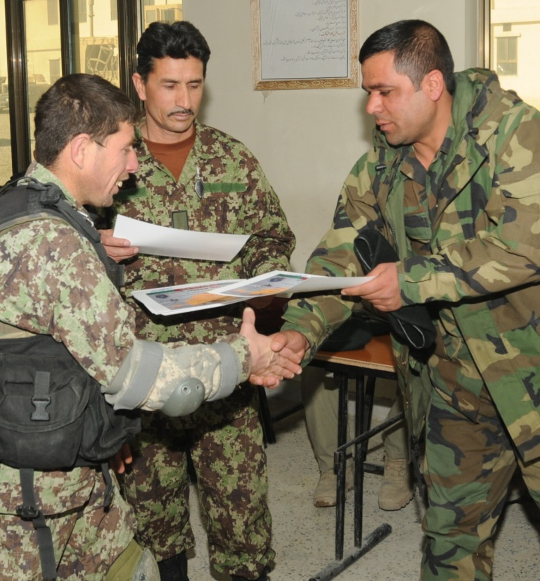 KABUL, Afghanistan - Twenty-five members of the Afghan Air Force, consisting of Airmen through Captain, graduated from the initial quick reaction force training course at the Afghan Air Force base at Kabul, Afghanistan, March 5. (U.S. Navy photo by Mass Communications Specialist 3rd Class Jared E. Walker)