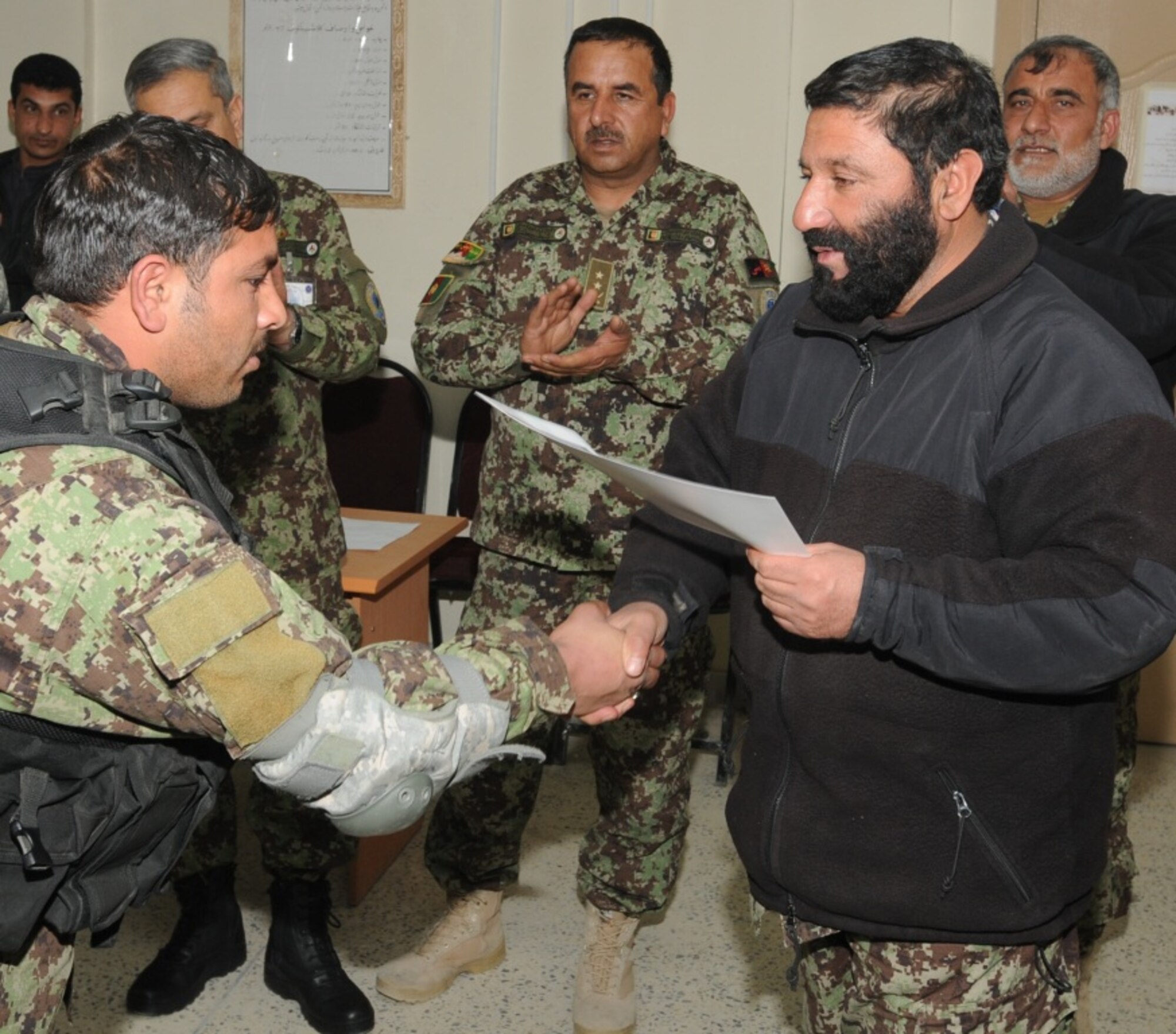 KABUL, Afghanistan - Twenty-five members of the Afghan Air Force, consisting of Airmen through Captain, graduated from the initial quick reaction force training course at the Afghan Air Force base at Kabul, Afghanistan, March 5. (U.S. Navy photo by Mass Communications Specialist 3rd Class Jared E. Walker)