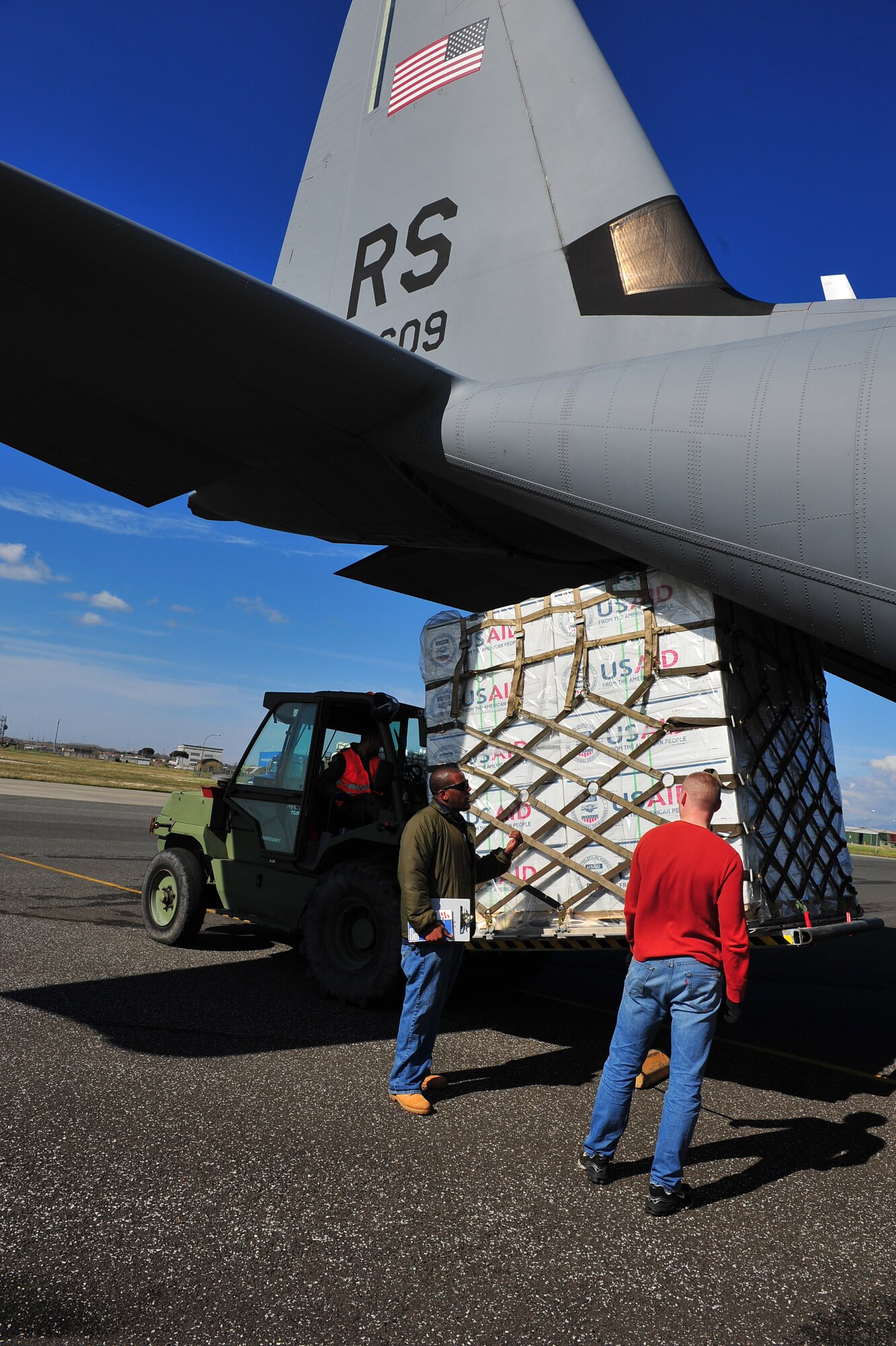 U.S. Airmen from the 435th Air Mobility Squadron, from Ramstein Air Base, picked up blankets, tarps and water containers from the U.S. Agency for International Development to load onto C-130 aircraft in Pisa, Italy. The Air Force will fly the supplies to Tunisia as part of the U.S. government's work with the international community to meet the humanitarian needs of the Lybian people and others in the country who fled across the borders during political unrest. (U.S. Army photo by Staff Sgt. Brendan Stephens)   
