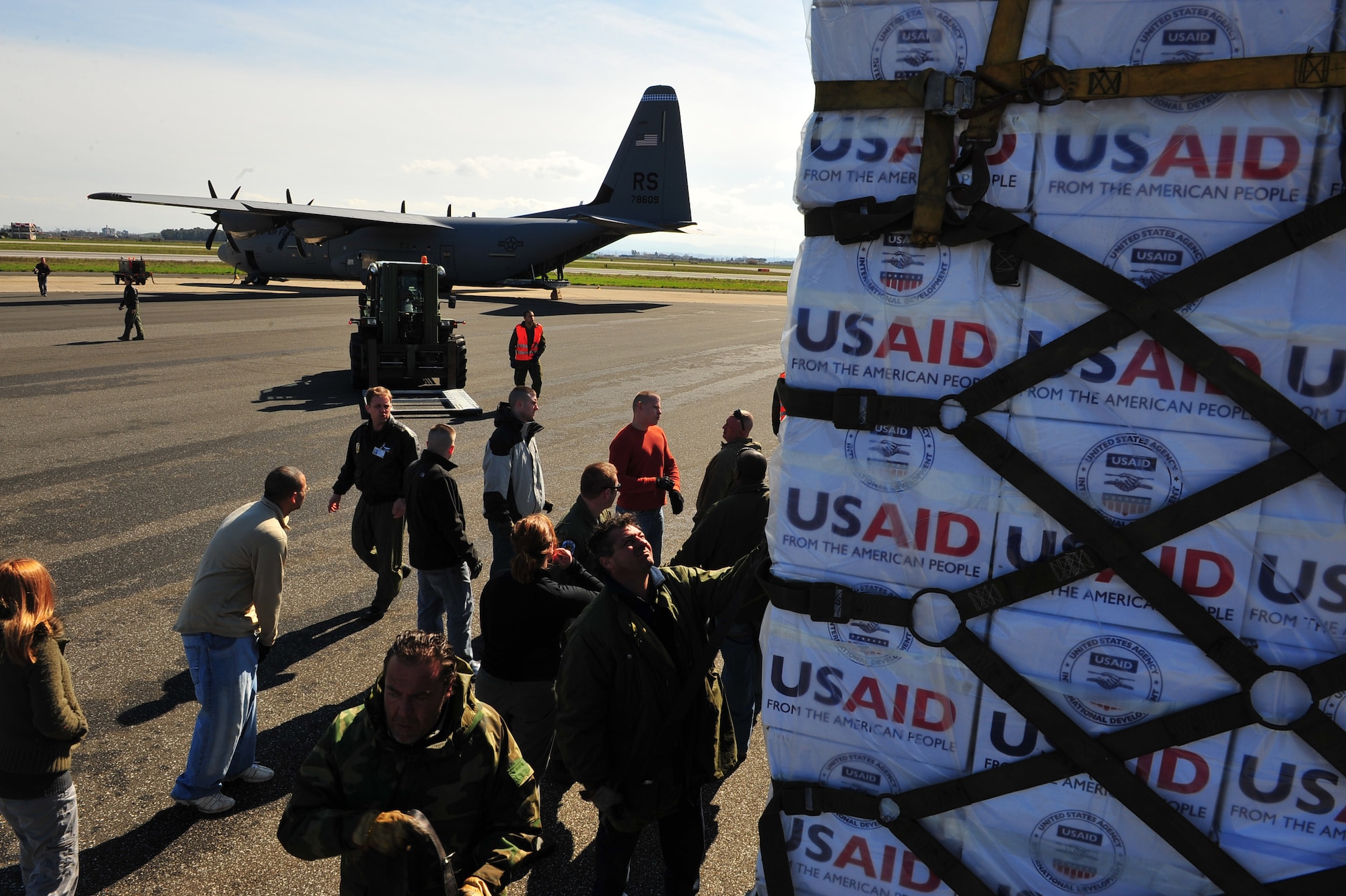 U.S. Airmen from the 435th Air Mobility Squadron, from Ramstein Air Base, picked up blankets, tarps and water containers from the U.S. Agency for International Development to load onto C-130 aircraft in Pisa, Italy. The Air Force will fly the supplies to Tunisia as part of the U.S. government's work with the international community to meet the humanitarian needs of the Lybian people and others in the country who fled across the borders during political unrest. (U.S. Army photo by Staff Sgt. Brendan Stephens)   
