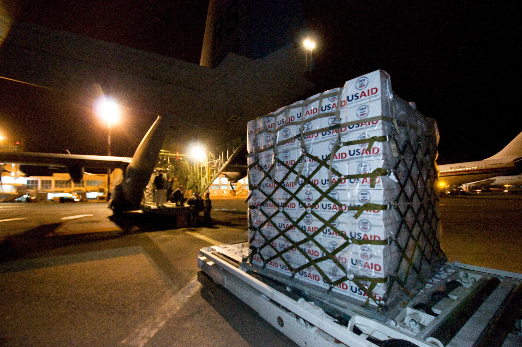 U.S. Airmen with the 435th Air Mobility Squadron, from Ramstein Air Base, Germany, unload blankets, tarps and water containers provided by U.S. AID at Djerba Zarzis Airport in Tunisia. The U.S. government is working with the international community to meet the humanitarian needs of the Lybian people and others in the country who fled across the borders in recent political unrest. (U.S. Army photo by Staff Sgt. Brendan Stephens)  
