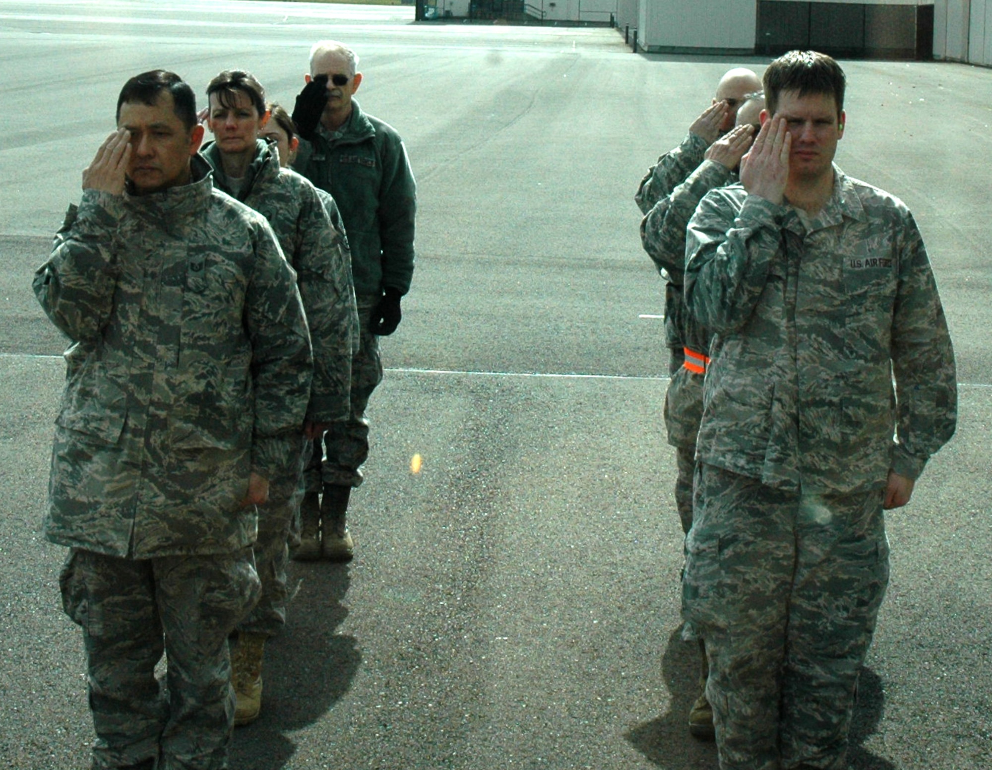 Reservists with the 446th Force Support Squadron Services Sustainment Flight, McChord Field, Wash., practice rendering a solemn salute to fallen heroes, as part of their joint exercise with the 86th Aerial Port Squadron, March 5. Reservists from both units got a better understanding of each other's responsbilities in the dignified transfer of casualties. (U.S. Air Force photo by Staff Sgt. Nicole Celestine/Released) 