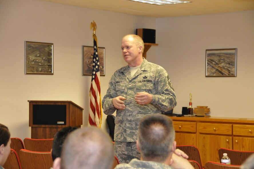 TUCSON, Ariz. – Chief Master Sgt. Chris Muncy, Air National Guard Command Chief Master Sergeant, talks with a group of Airmen during a visit to Tucson and the 162nd Fighter Wing, March 6.  Chief Muncy represents the highest level of enlisted leadership for the ANG.  He is responsible for the interest regarding welfare, readiness, morale, proper utilization and progress concerning the enlisted personnel of the ANG. “Most of the public doesn’t know who you are as a Guardsmen or what you do in the Air National Guard. Don’t be afraid to let them know what it is that you do and why it matters,” said the chief. “I let the general public and the guys back in DC know about the uniqueness of you as enlisted Guardsmen. I hear what it is that you have to say. I’ll put it on a plane today and take it back east with me.” (U.S. Air Force photo/Tech. Sgt. Hollie Hansen)