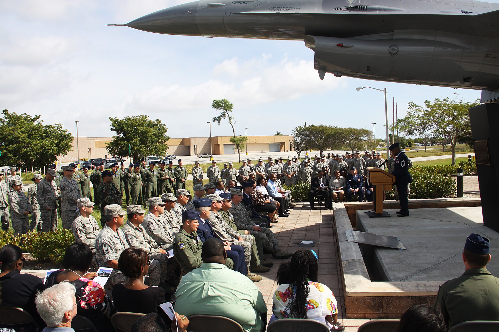 Members of the 482d Fighter Wing friends, family, and Wingmen gathered outside the Homestead Air Reserve Base to witness the unveiling of a plaque dedicated to Master Sgt Adolf Crawford on March 6. (Photo by Senior Airman Lou Burton, 482d Public Affairs)