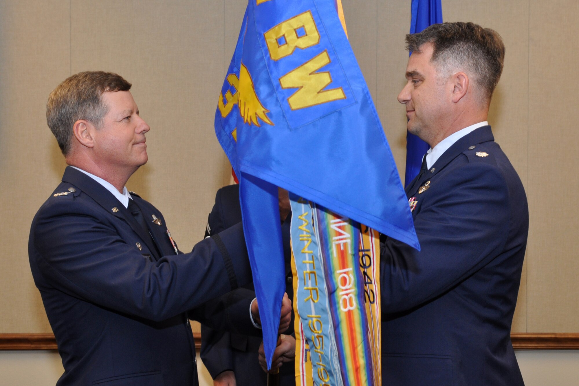 With the passing of the guidon from Colonel Keith Schultz, commander, 307th Operations Group, Lt. Col. David Leedom assumes command of the 93rd Bomb Squadron during a change of command ceremony at the 93rd BS on Barksdale Air Force Base, La., March 5, 2011. Colonel Leedom took the reins from Colonel (S) Joseph Jones, who is leaving the 93rd BS to take the position of vice commander of the 307th Bomb Wing. Colonel Leedom becomes the 10th commander of the 93rd BS at Barksdale. (U.S. Air Force photo/Tech. Sgt. Jeff Walston)
