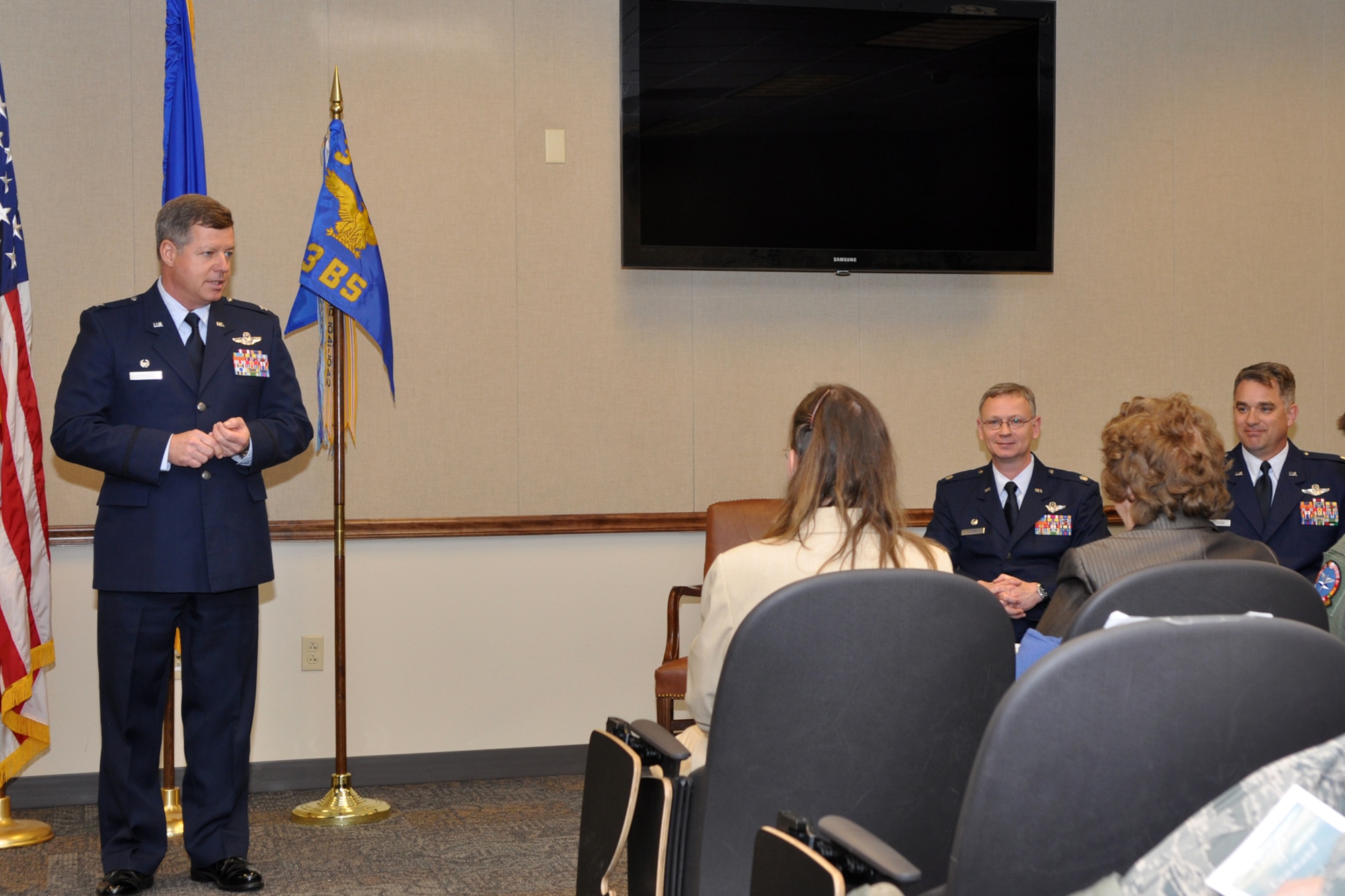 Colonel Keith Schultz, commander, 307th Operations Group, has words of praise for both Colonel (S) Joseph Jones and Lt. Col. David Leedom during a change of command ceremony at the 93rd Bomb Squadron, at Barksdale Air Force Base, La., March 5, 2011. Colonel Leedom (far right) took the reins from Colonel Jones, who is leaving the 93rd BS to take the position of vice commander of the 307th Bomb Wing. Colonel Leedom becomes the 10th commander of the 93rd BS at Barksdale. (U.S. Air Force photo/Tech. Sgt. Jeff Walston)