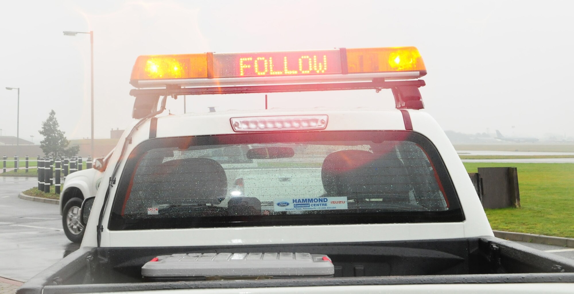 RAF MILDENHALL, England -- Transient Alert's "Follow Me" trucks now have the instructions to the pilots on scrolling lights. The TA drivers take a truck out to meet the incoming aircraft once it has landed, and lead it back to its parking spot. The flight works day and night, covering all inbound and outbound flights from aircraft transiting RAF Mildenhall. (U.S. Air Force photo/Karen Abeyasekere)