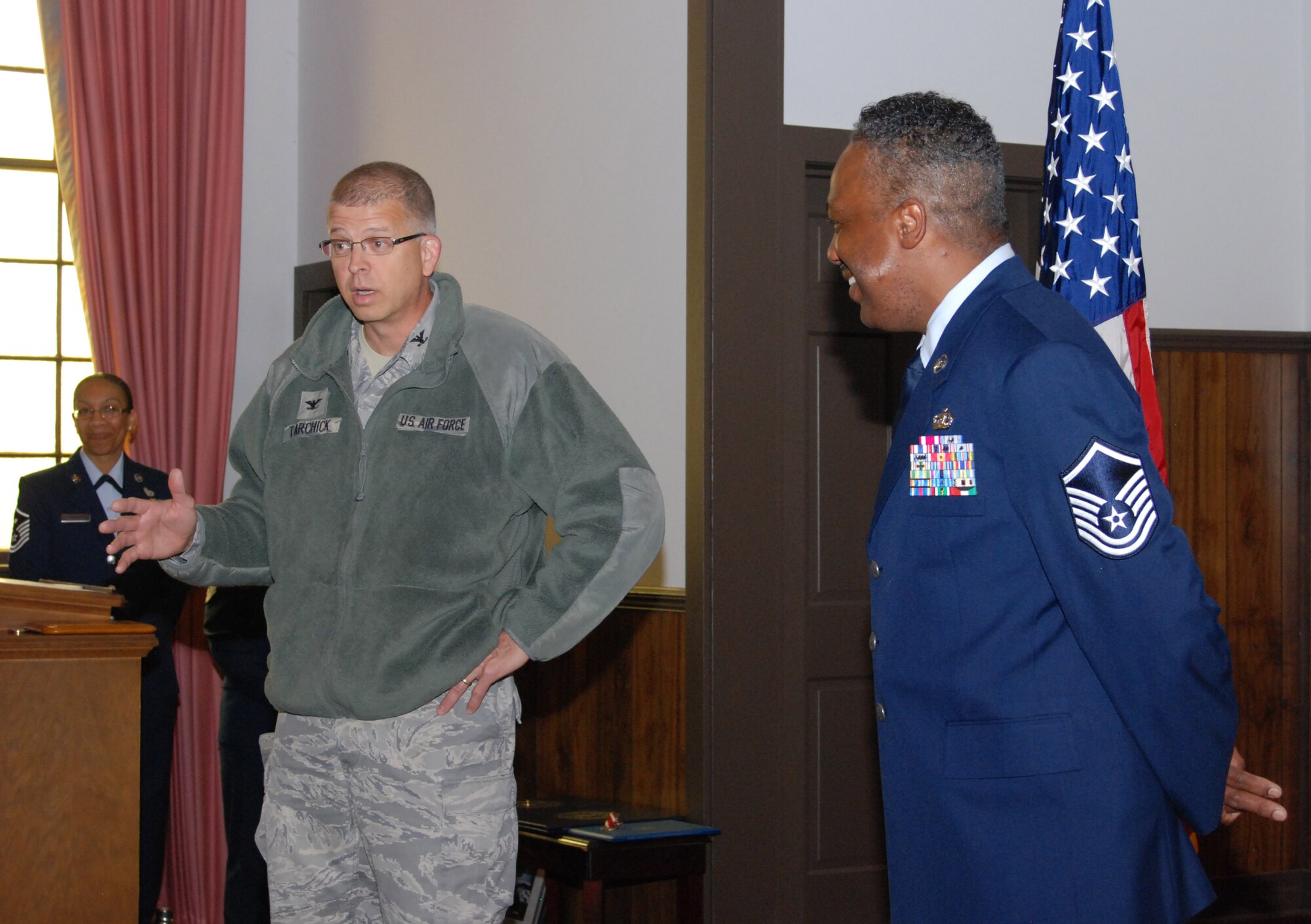 Col. Timothy Tarchick, 94th Airlift Wing commander, speaks on Master Sgt. Mike Varnado's 36-year career during his retirement ceremony March 5.  Sergeant Varnado, 94th Operations Life Support assistant NCOIC is  retiring after 36 years of service to the United States Air Force and Air Force Reserve.  (U.S. Air Force photo/Master Sgt. Stan Coleman)