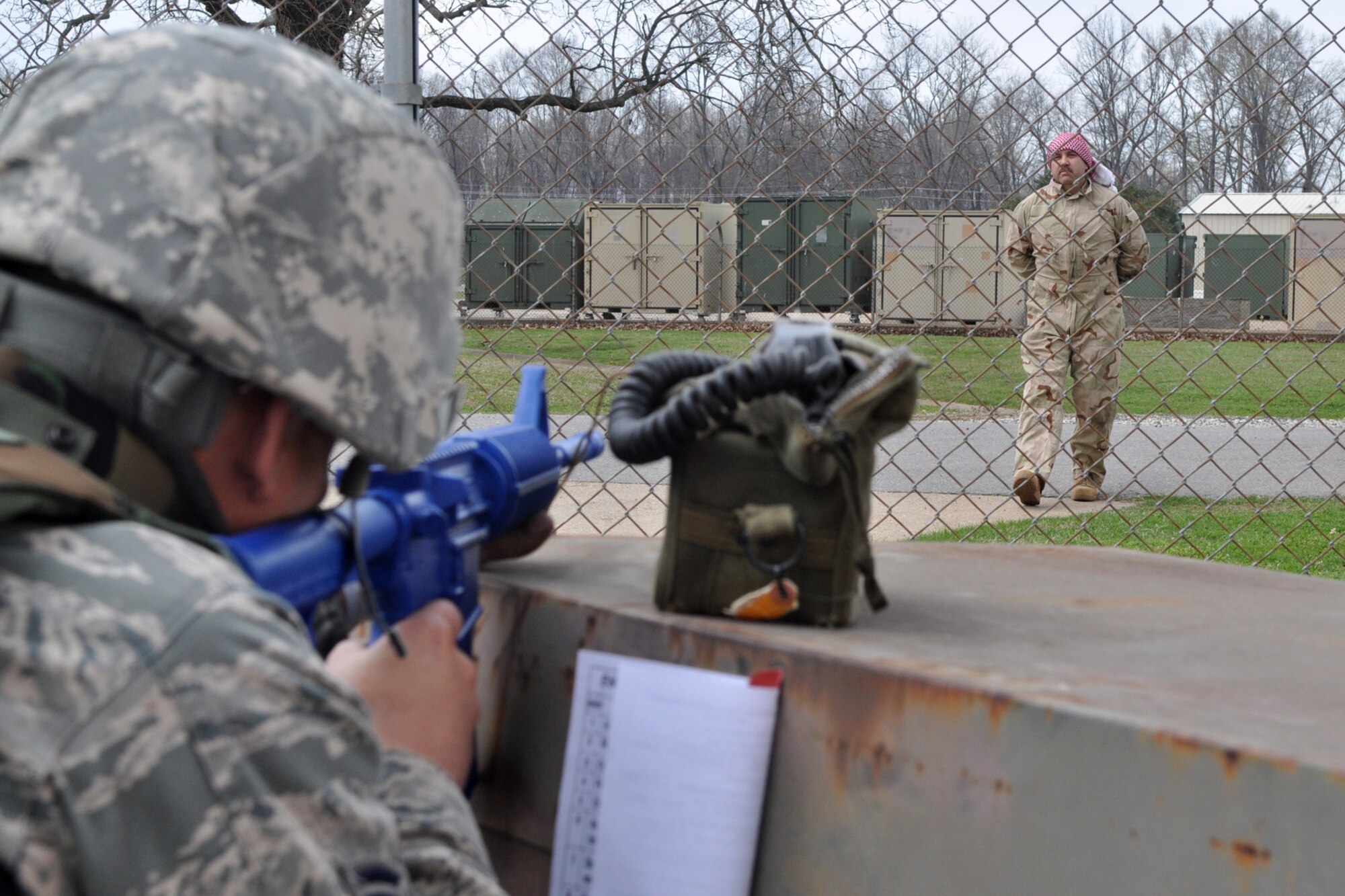 Senior Master Sgt. John Mattheis, pavement construction equipment operator, 307th RED HORSE Squadron, portrays an indigenous resident during a four-day exercise at the RED HORSE Squadron compound on Barksdale Air Force Base, La., March 4, 2011. Members of the 307th RED HORSE Squadron are participating in an exercise that is designed to simulate a deployment to a Southwest Asia location where the Airmen are building helicopter landing pads for a U.S. Marine Unit. (U.S. Air Force photo/Tech. Sgt. Jeff Walston)

