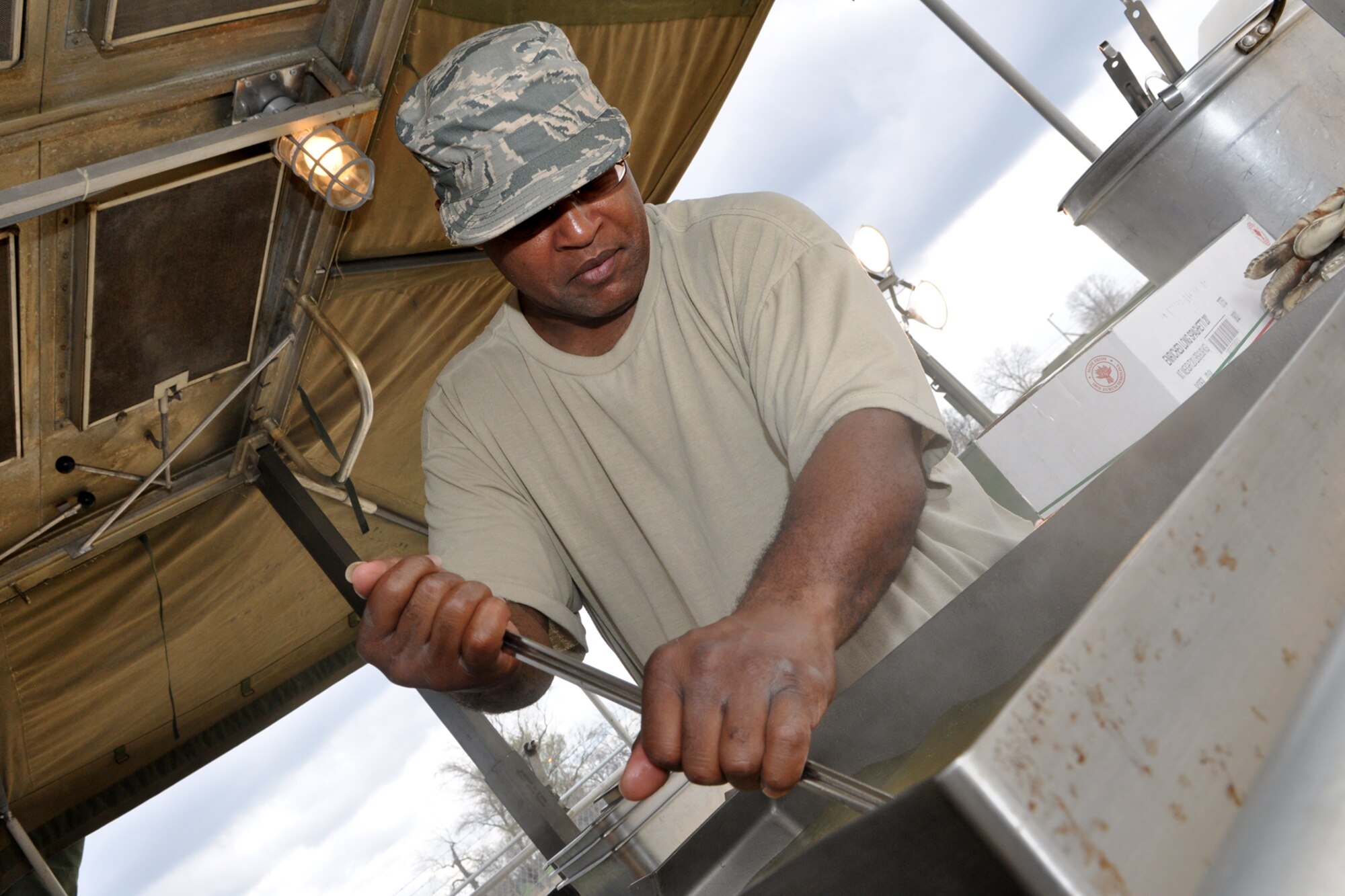 Master Sgt. Arty Spiller, services superintendent, 307th RED HORSE Squadron, prepares spaghetti noodles during a four-day exercise at the RED HORSE Squadron compound on Barksdale Air Force Base, La., March 4, 2011. Members of the 307th RED HORSE Squadron are participating in an exercise that is simulating a deployment to a Southwest Asia location where the Airmen are building helicopter landing pads for a U.S. Marine Unit. (U.S. Air Force photo/Tech. Sgt. Jeff Walston)