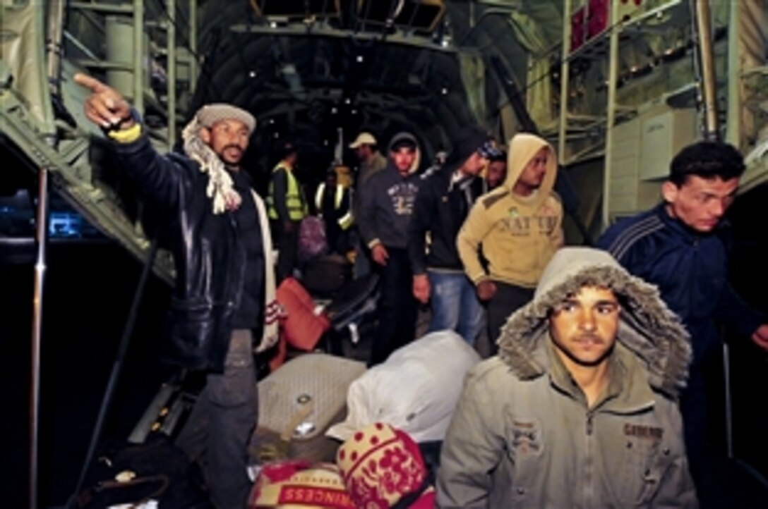Egyptian citizens arrive home on a U.S. Air Force C-130J, Cairo, Egypt, March 6, 2011. U.S. military aircraft began airlifting evacuees as part of a broader government effort to provide humanitarian aid during the crisis in Libya. 