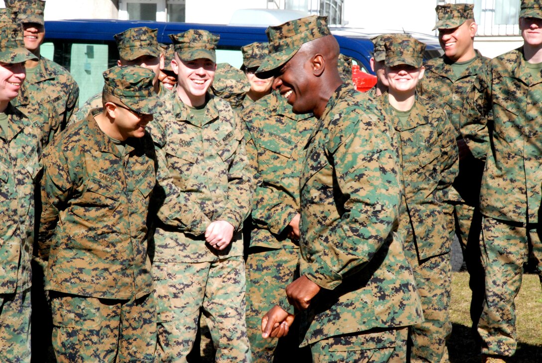 Sergeant Major of the Marine Corps Sgt. Maj. Carlton Kent jokes with the Marines of Marine Forces Europe and Africa outside their Headquarters Building, March 7.::r::::n::Kent stressed that the Marines in Germany were living examples of how a small amount of Marines are able to do great things. He reassured the Marines that there will not be any cuts to the size of the Marine Corps until combat operations in Afghanistan are finished, and even then they will not affect them.