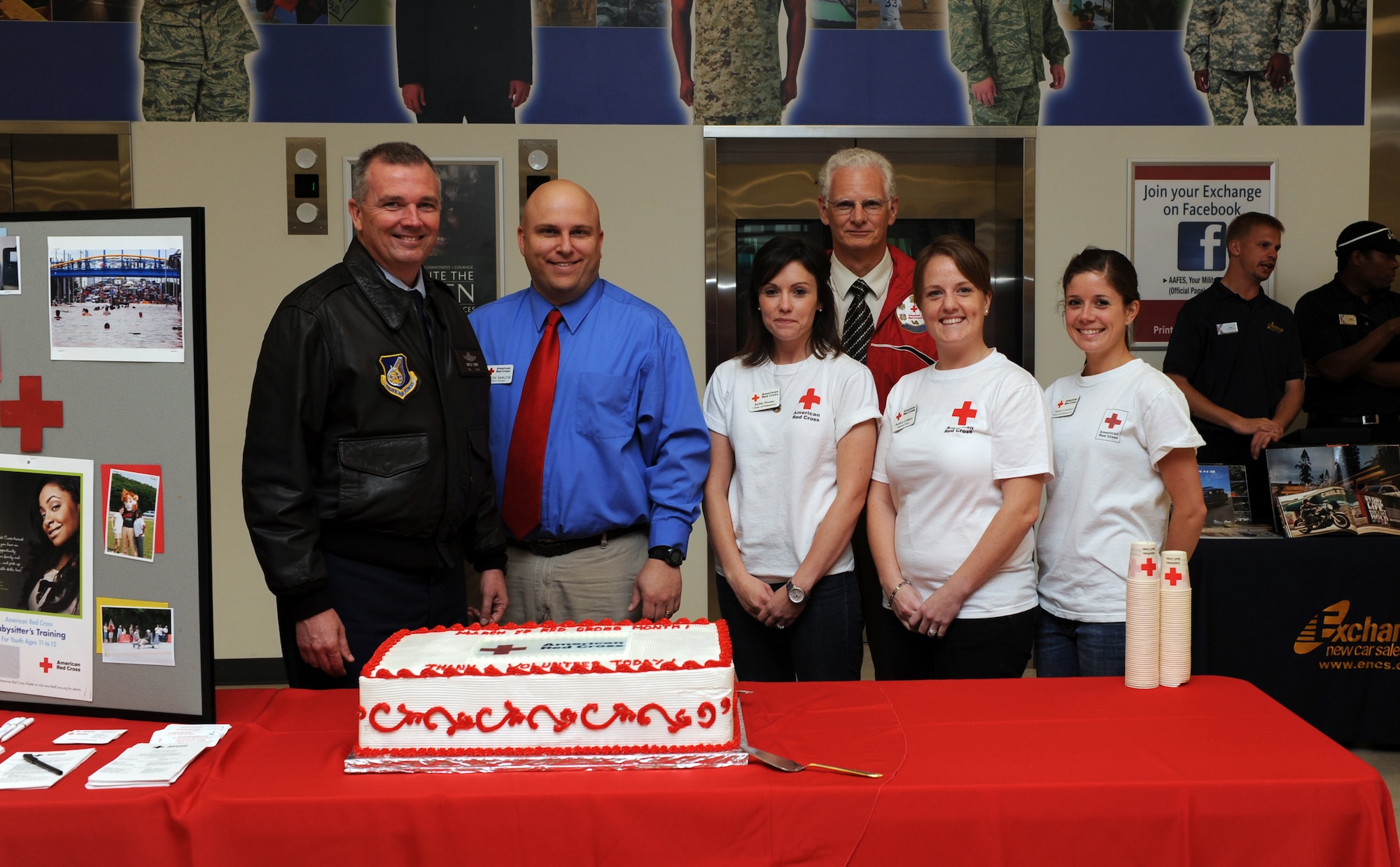 Col. Ricky Rupp, 18th Wing vice commander, poses with members from the American Red Cross during a Red Cross Month kick off celebration at Kadena's Base Exchange, March 7. During this month people are encouraged to donate their time to help victims of disaster, by either volunteering, donating blood or giving a monetary donation. (U.S. Air Force photo/Junko Kinjo)