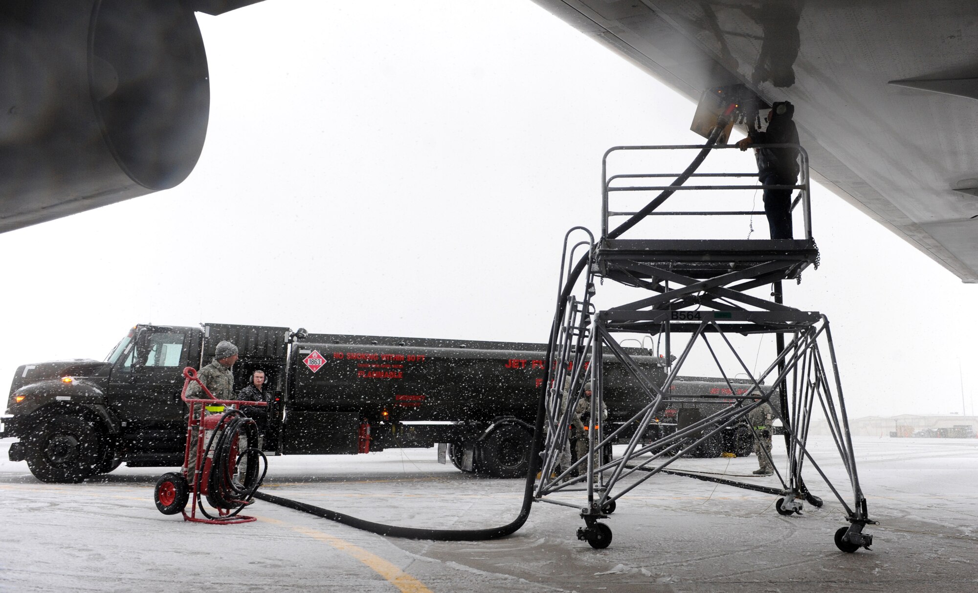 MOUNTAIN HOME AIR FORCE BASE, Idaho - -A team from the 366th Logistics Readiness Squadron petroleum, oils and lubricants flight fuels an aircraft before the 389th Aircraft Maintenance Unit deployment, March 7. More than 400 Airmen from across the 366th Fighter Wing are deploying in support of Operation Enduring Freedom. Airmen in a variety of non-aviation roles are scheduled to conduct a wide range of tasks to ensure the success of providing critical combat power capabilities. (U.S. Air Force photo by Senior Airman Debbie Lockhart)
