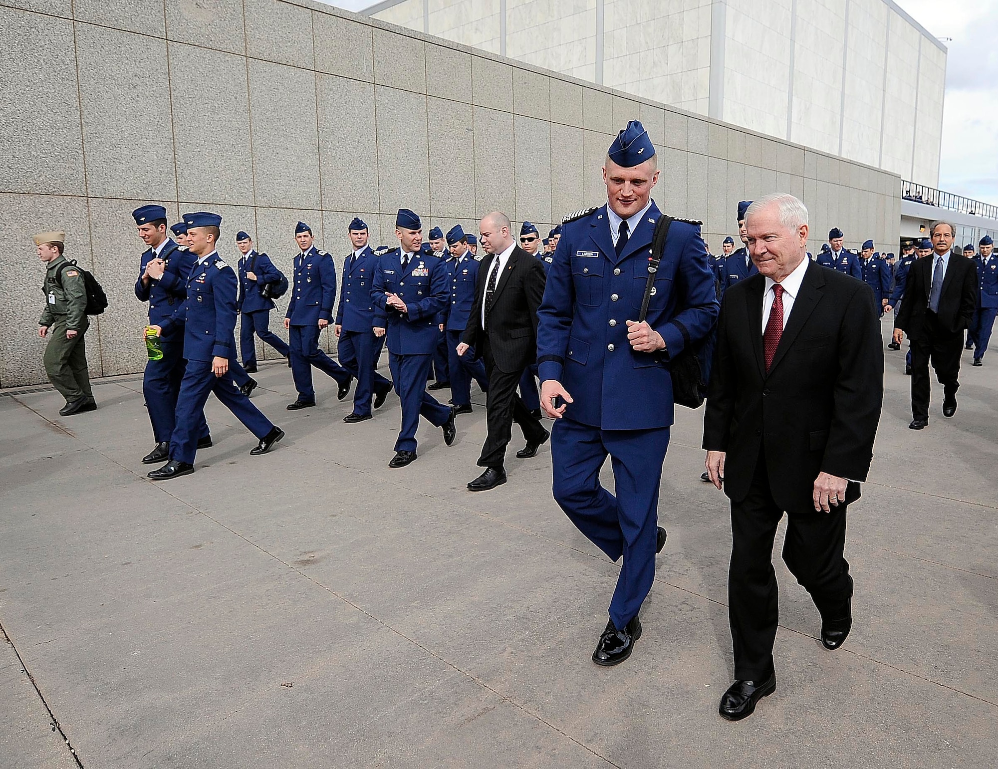 Defense Secretary Robert M. Gates walks with Air Force Academy Cadet Wing Commander Josh Larson prior to teaching a political science and a national security class March 4, 2011, as part of the Capstone Seminar at the Air Force Academy in Colorado Springs, Colo.  (Defense Department photo/Master Sgt. Jerry Morrison)