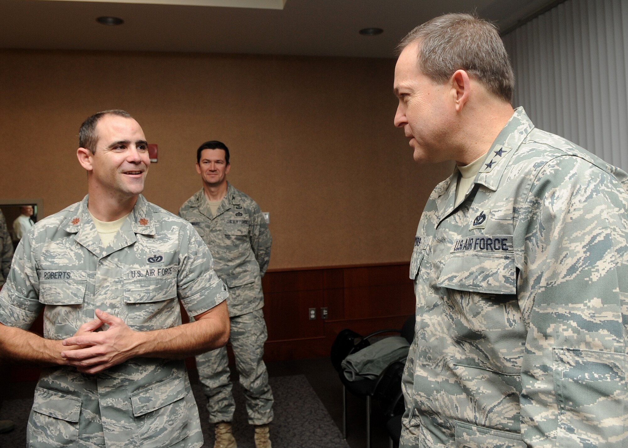 Buckley Air Force Base, Colo.- Maj. Gen. Timothy Byers, Air Force Civil Engineer, and Maj. Adam Roberts, 460th Civil Engineering Squadron discuss brief information about the construction here at Buckley Mar 3, 2011. Maj. Gen Byers visited Buckley to inspect the Visitors Quarters/Temporary Lodging Facility and tour additional building new to Buckley AFB.  ( U.S. Air Force Photo by Airman 1st Class Marcy Glass )
