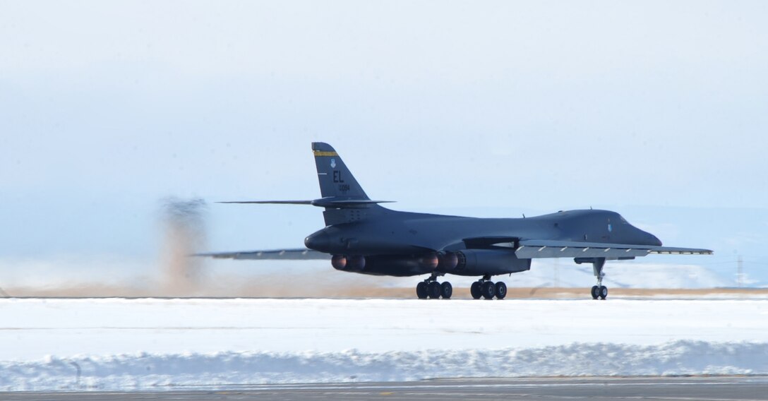 A B-1B Lancer prepares for takeoff at Ellsworth Air Force Base, S.D., March 4, 2011.  As the B-1 takes off, 8-year-old Noah Misselt from Box Elder, S.D., gets a close-up look as part of the Aircrew for a Day program.  Noah is the third youth to participate in the program since it was revised in June 2010. (U.S. Air Force photo/Senior Airman Anthony Sanchelli)  
