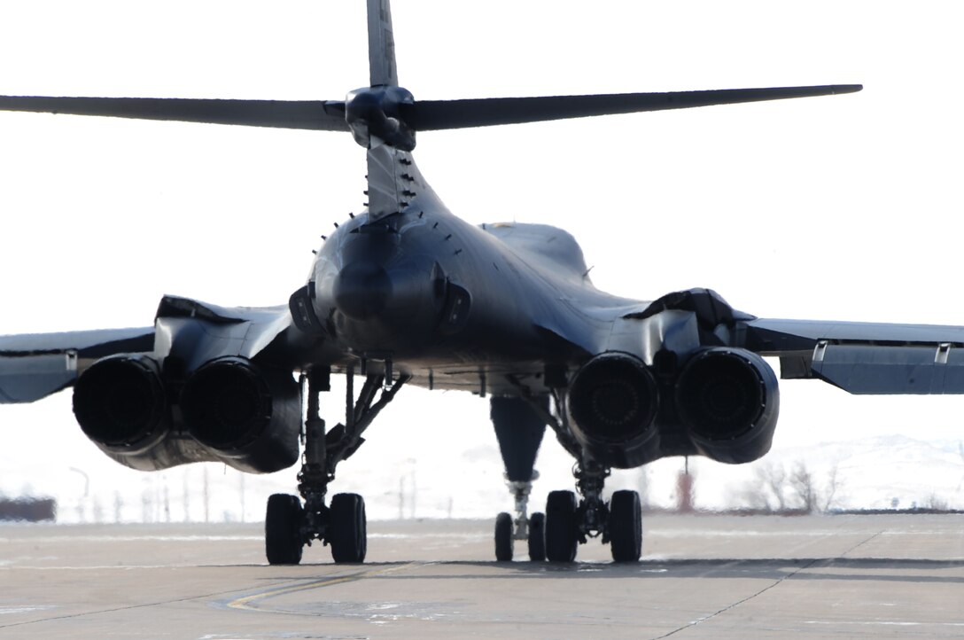 A B-1B Lancer prepares for takeoff at Ellsworth Air Force Base, S.D., March 4, 2011.  As the B-1 takes off, 8-year-old Noah Misselt from Box Elder, S.D., got an up close look during the Aircrew for a Day program.  Noah is the third youth to participate in the program since it was revised in June 2010. (U.S. Air Force photo/Senior Airman Anthony Sanchelli)  

