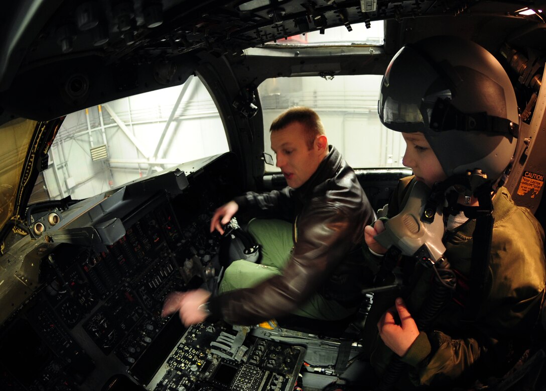 Eight-year-old Noah Misselt from Box Elder, S.D., takes a tour of a B-1B Lancer with Capt. Christopher Stallard, 34th Bomb Squadron pilot, during the Aircrew for a Day program at Ellsworth Air Force Base, S.D., March 4, 2011.  Noah is the third youth to participate in the program since it was revised in June 2010. (U.S. Air Force photo/Senior Airman Anthony Sanchelli)  
