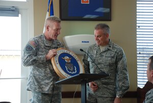 SOTO CANO AIR BASE, Honduras - Joint Task Force-Bravo commander Col. Gregory Reilly (left) presents USSOUTHCOM Deputy Command Chaplain Lt. Col. Randy Marshall with a plaque during the National Prayer Observance Luncheon here Mar. 07.  Colonel Marshall was the keynote speaker at the event.  (Air Force photo/Capt. John T. Stamm)