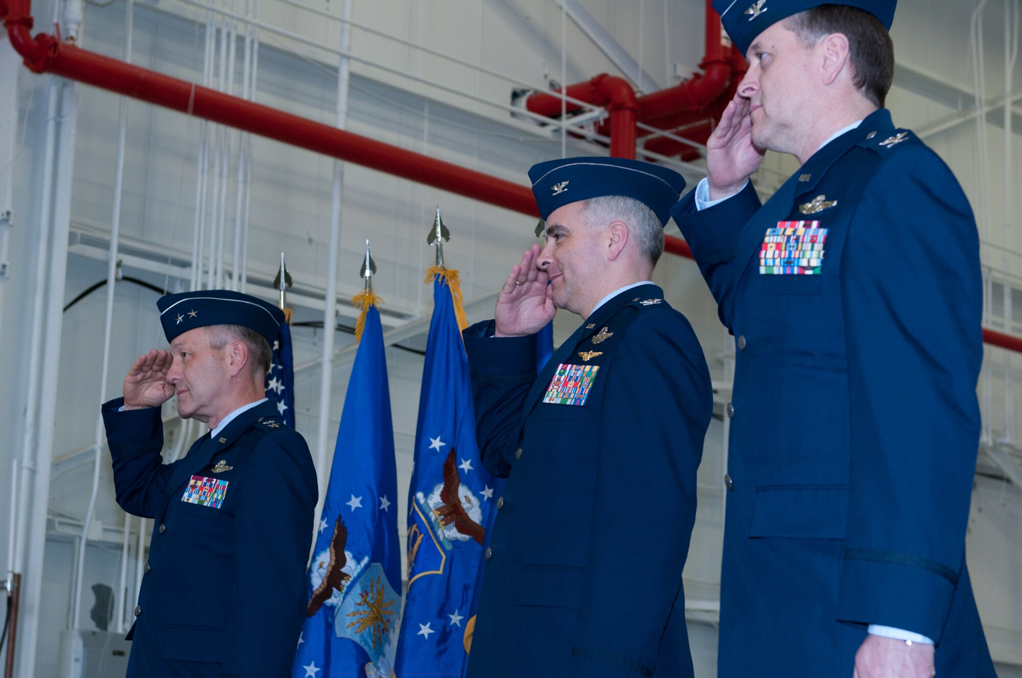 JOINT BASE ANDREWS, Md. -- Maj. Gen. Eric W. Crabtree (far left), 4th Air Force commander, joins Col. James M. Allman (center) and Col. Russell A. Muncy (far right), in a change of command ceremony here Mar. 5. Colonel Muncy took command of the 459th Air Refueling Wing from Colonel Allman, who retired from the Air Force after 26 years of military service. (U.S. Air Force photo/Staff Sgt. Sophia Piellusch)