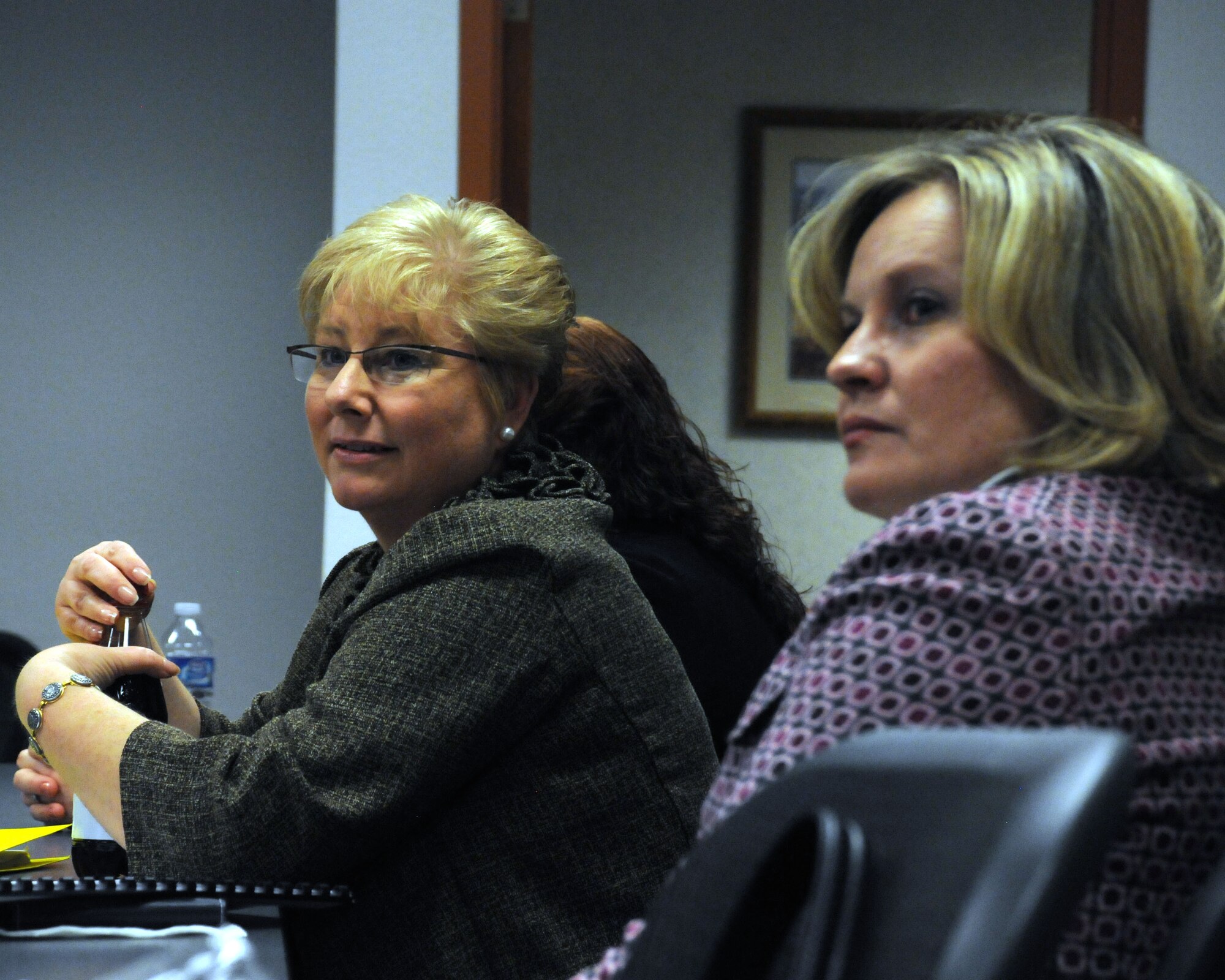 Paula Roy (left), wife of Chief Master Sergeant of the Air Force James Roy, and Julie Tims, wife of Col. Gregory Tims, the 90th Missile Wing commander, listen to a briefing March 3, 2011, at the Airmen and Family Readiness Center at F. E. Warren Air Force Base, Wyo. (U.S. Air Force photo/R.J. Oriez)