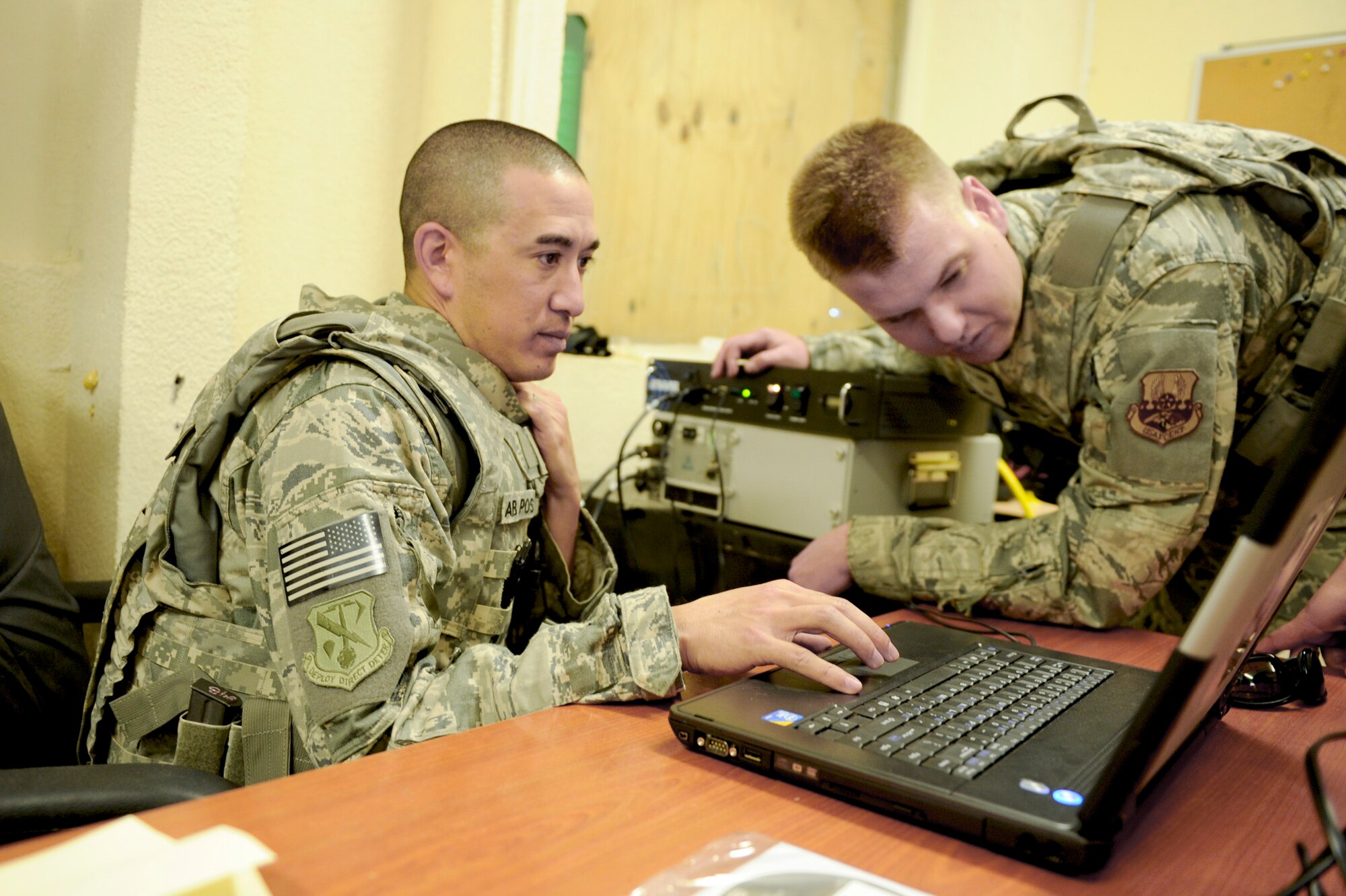 Master Sgt. Stephen Hale (left) and Senior Airman Ryan Unger system check a TMQ-53 weather observation system and an Ellason Weather Radar 600 after setting them up at the control tower March 2, 2011, at Qayyarah West Airfield, Iraq. Sergeant Hale and Airman Unger were part of a three-man weather team that traveled from Baghdad to retrieve U.S. Air Force equipment and install a newly purchased system as part of an ongoing process to set up a self-sustained Iraqi military weather service. Sergeant Hale and Airman Unger are from the 22nd Expeditionary Weather Squadron. (U.S. Air Force photo/Staff Sgt. Levi Riendeau)