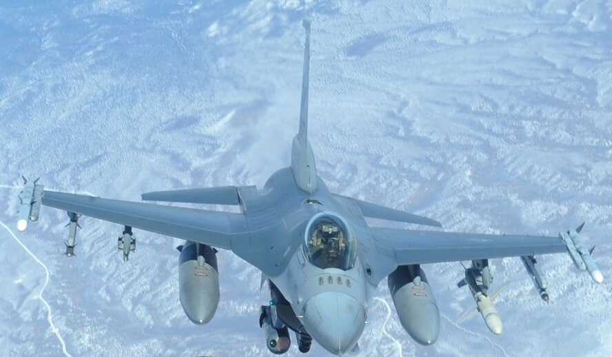 NELLIS AIR FORCE BASE, Nev. -- An F-16CJ Fighting Falcon prepares to receive fuel from a KC-135R Stratotanker as part of Operation Red Flag 11-3 Feb. 28. The F-16CJ is a single-seat, multi-mission fighter with the ability to switch from an air-to-ground to air-to-air role at the touch of a button. The KC-135R has provided the core air refueling capability for the United States Air Force for over 50 years. Red Flag is a realistic combat training exercise that provides heavily-contested and degraded operational environments to prepare crews for major combat operations against a near-peer adversary. (U.S. Air Force photo by 2nd Lt. Tony Richardson) (Released)