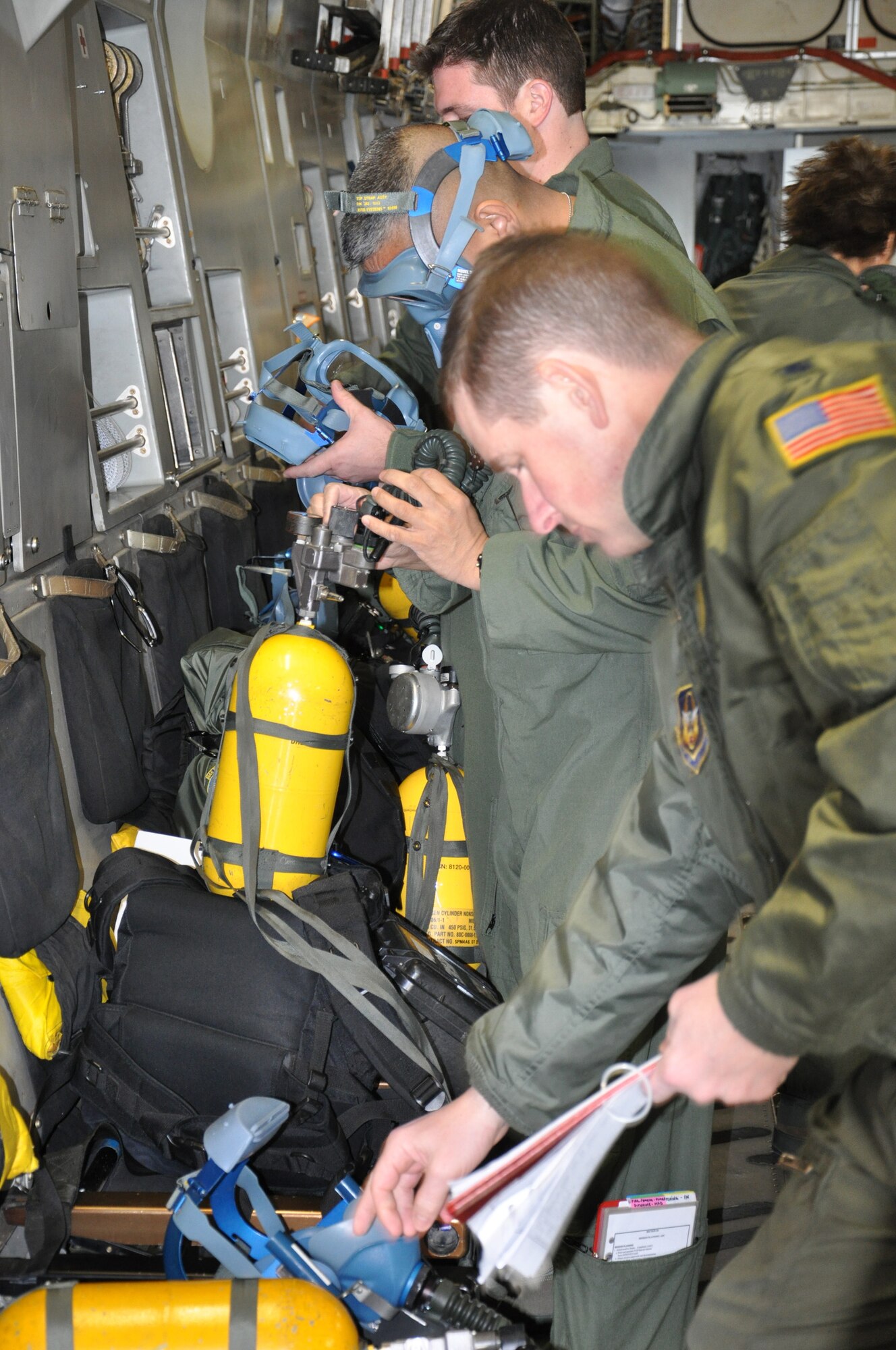 WRIGHT-PATTERSON AIR FORCE BASE, Ohio – Lt. Col. Todd Mulhorn, 445th Aeromedical Evacuation Squadron operations officer, checks his oxygen mask and gear in preparation for a training flight on a C-17 Globemaster III Feb. 18.  This is the first time the 445th AES participated in a training mission with other 445th units (the 89th Airlift Wing and 445th Operations Support Squadron).  (U.S. Air Force photo/Stacy Vaughn)