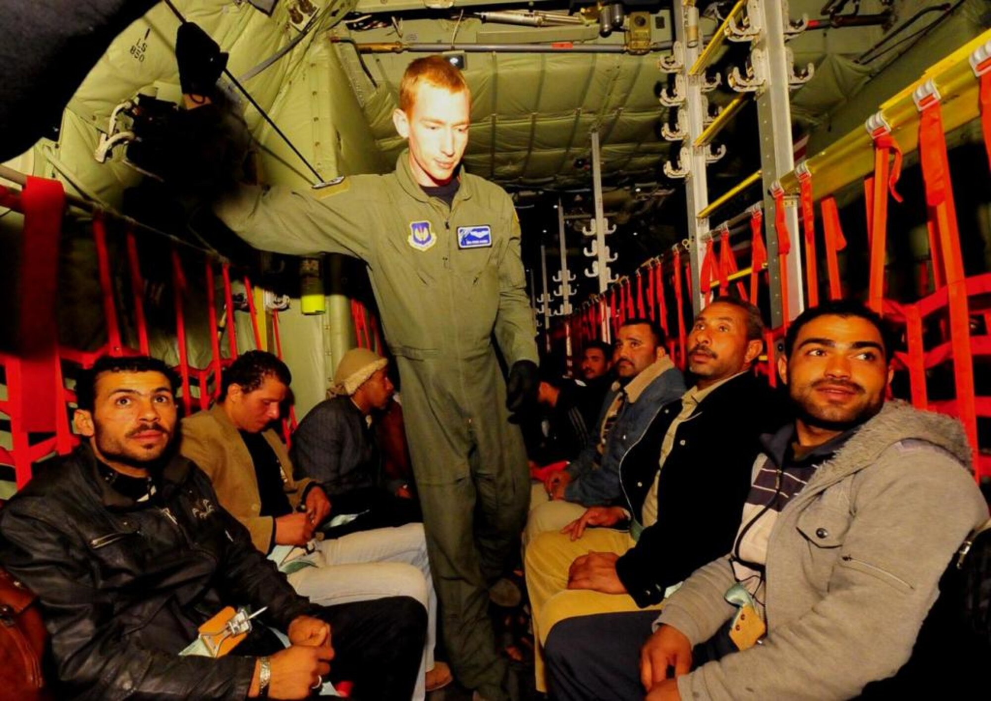 Displaced Egyptian citizens who have fled to Tunisia from violence and instability in Libya are transported aboard a U.S. Air Force C-130J Super Hercules from Djerba, Tunisia, to Cairo, Egypt, on March 5, 2011. This response to the developing humanitarian crisis is part of a broader U.S. government effort to relieve suffering caused by the crisis the in Libya. (U.S. Air Force Photo/Staff Sgt. Brendan Stephens) 