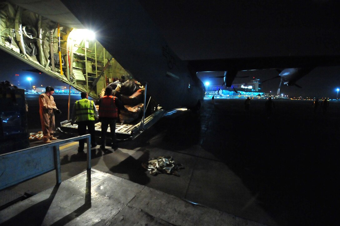 A C-130J from Ramstein Air Base, Germany carrying Egyptian refugees arrives March 5, 2011, at Cairo's International Airport. This was the first of many scheduled flights from Djerba, Tunisia to Cairo, Egypt. This response to the migration emergency is part of the U.S. forces commitment to providing humanitarian assistance to refugees and displaced victims of the crisis in Libya. (U.S. Army photo/Staff Sgt. Brendan Stephens)