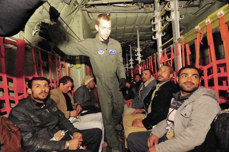 Displaced Egyptian citizens who fled to Tunisia from violence and instability in Libya are transported aboard an Air Force C-130J from Djerba, Tunisia to Cairo, Egypt March 5, 2011. This response to the developing humanitarian crisis is part of a broader U.S. government effort to relieve suffering caused by the crisis the in Libya. (U.S. Army photo/Staff Sgt. Brendan Stephens)