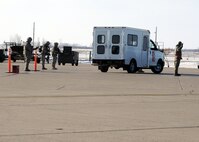 MINOT AIR FORCE BASE, N.D. -- Airmen of 5th Security Forces Squadron detain two members of 5th Aircraft Maintenance Squadron during a suspected security incident, here Mar. 1. The Airmen were on duty as part of an operational readiness inspection. (U.S. Air Force photo/ Senior Airman Michael J. Veloz)