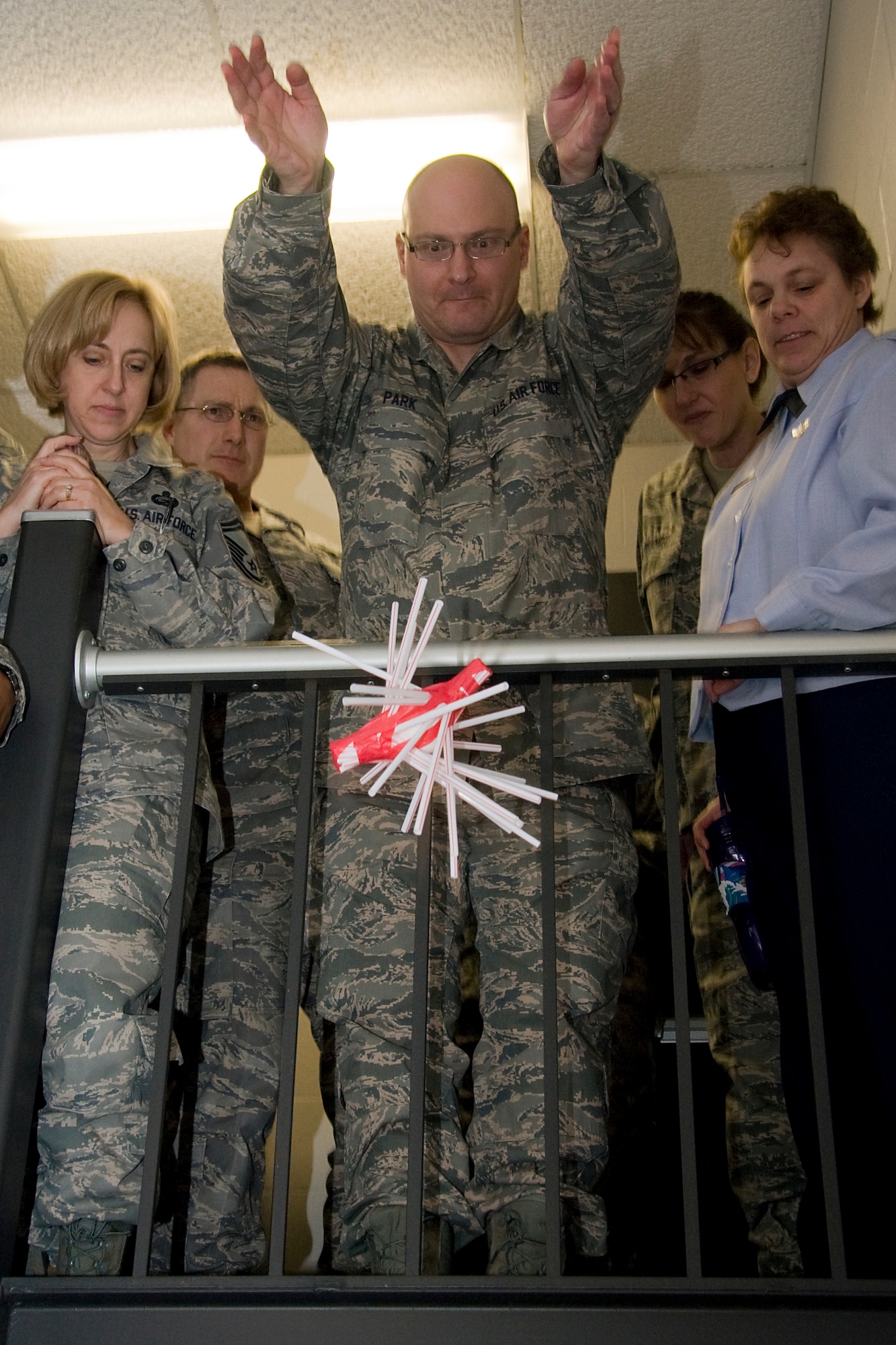 GRISSOM AIR RESERVE BASE, Ind. -- Tech. Sgt. James Park, 434th Force Support Squadron orderly room noncommissioned officer in charge, drops his team's egg protection device from the top of a stairwell during the team building portion of Wingman Day here March 6. Airmen from the 434th Air Refueling Wing participated in a three-hour training session that focused on building Airmen resiliency and overall unit cohesion. Pictured alongside Sergeant Park, from left, are Master Sgt. Juanita Withrow, Maj. Patrick O'Neil, Staff Sgt. Laura Brandt and Master Sgt. Lisa Fitzgerald. All are members of the 434th FSS. (U.S. Air Force photo/Tech. Sgt. Mark R. W. Orders-Woempner)
